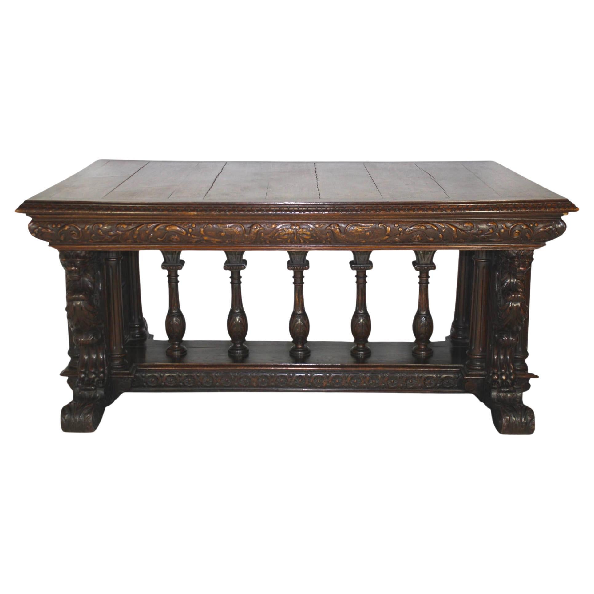 Created with excellent craftsmanship and solid construction in Europe during the late-19th century, this oak dining table is adorned with an array of extraordinary carvings. Four fierce, winged lions, which are carved with great detail on the