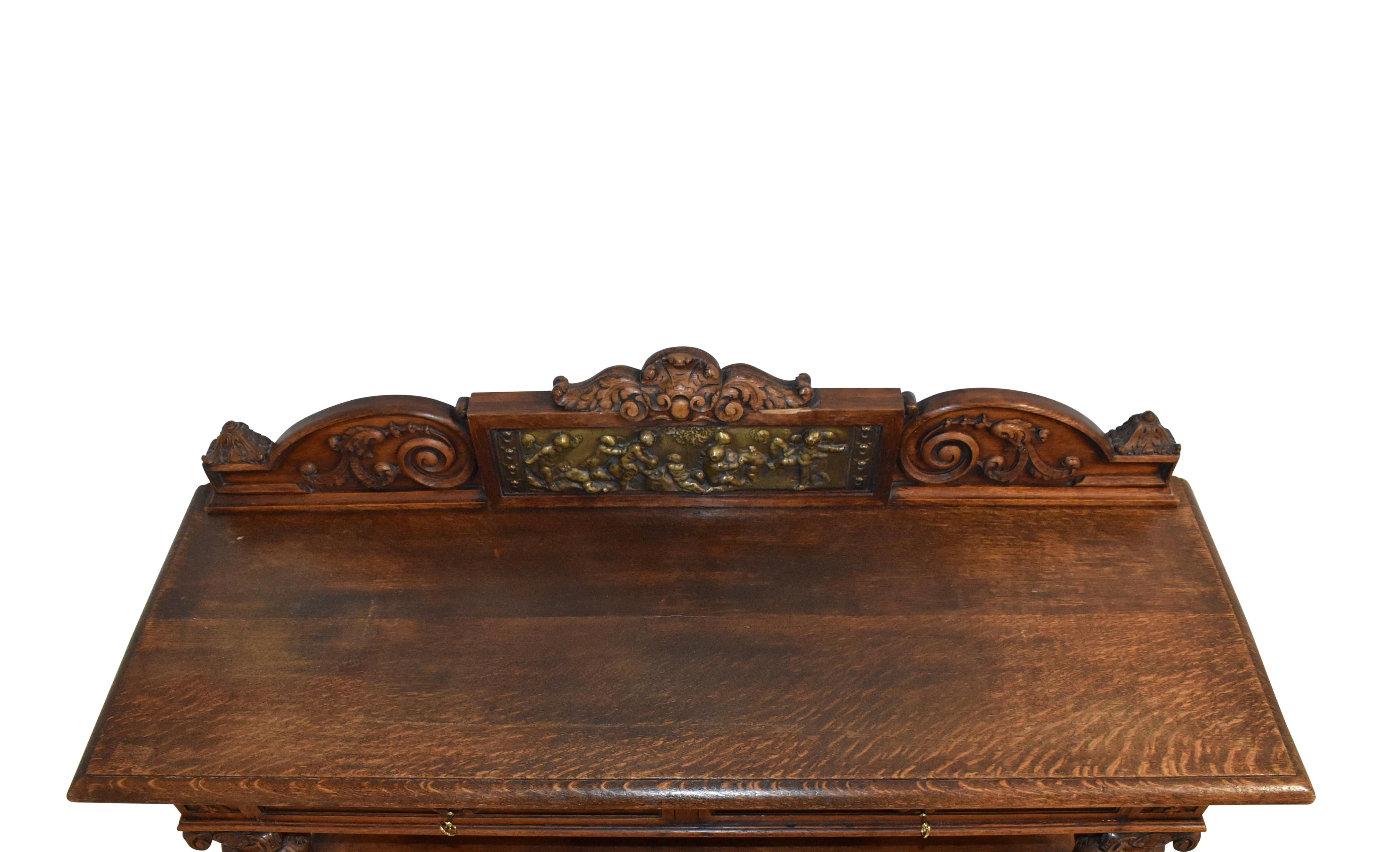 Carved Oak Server Buffet with Decorative Putti Copper Panel For Sale 2