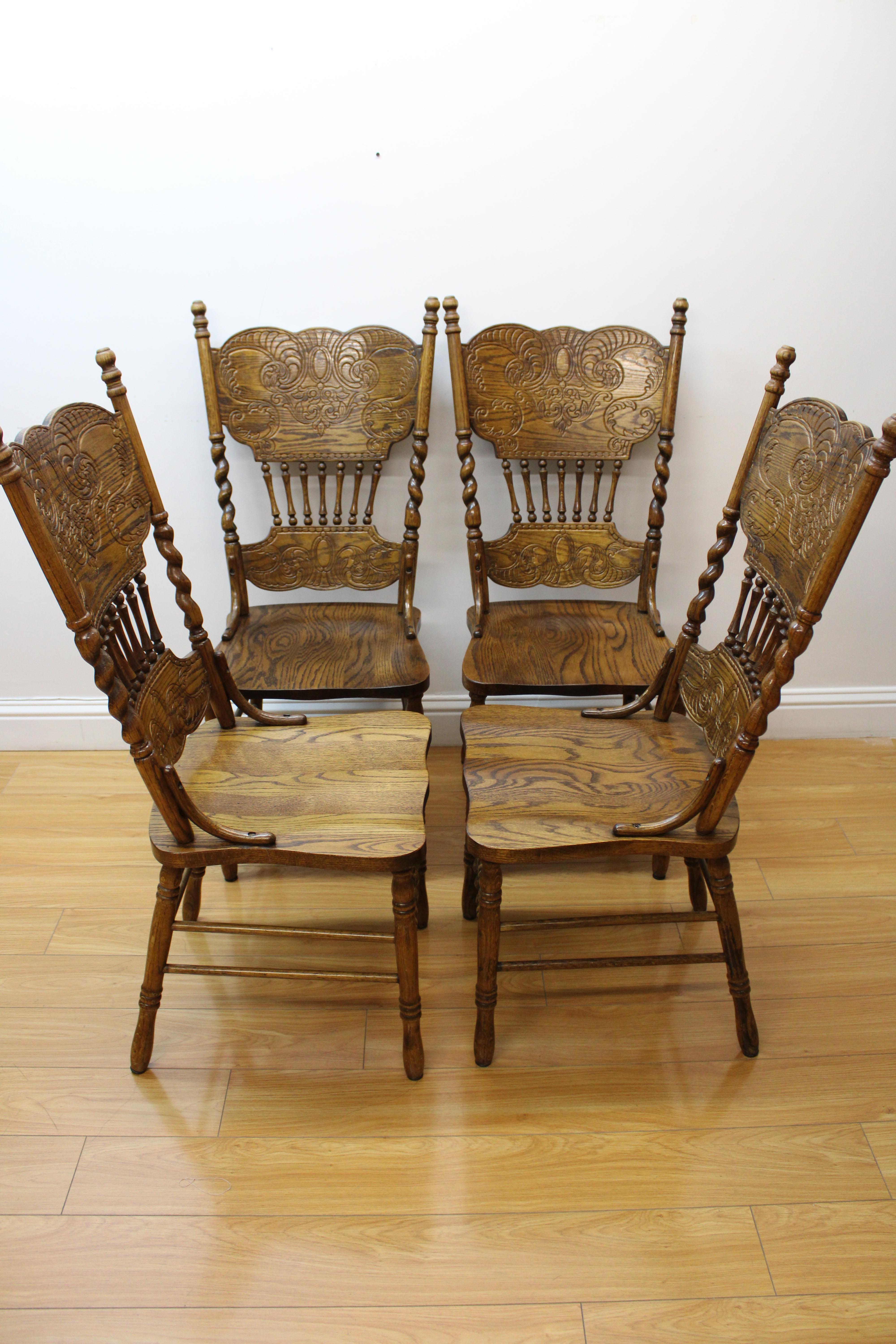 C. early 20th century

Carved oak side chairs w/ barley twisted carvings.