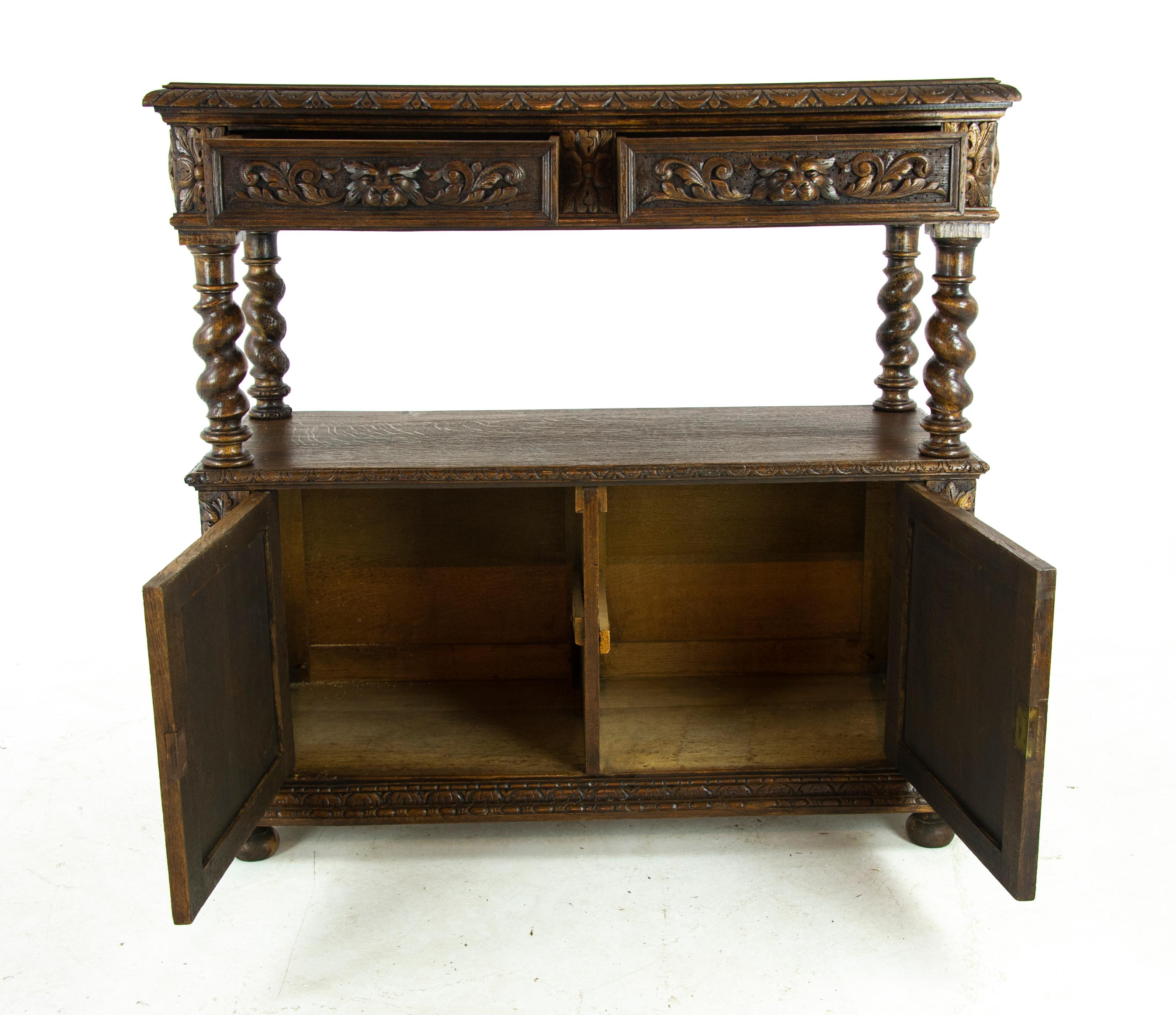 Carved oak sideboard, barley twist buffet, dumb waiter, Scotland, 1870, Antique Furniture, B1489, 

Scotland 1870
Rectangular top
Carved molded edge
Pair of carved drawers with griffin mask handles and leaves
Four thick barley twist