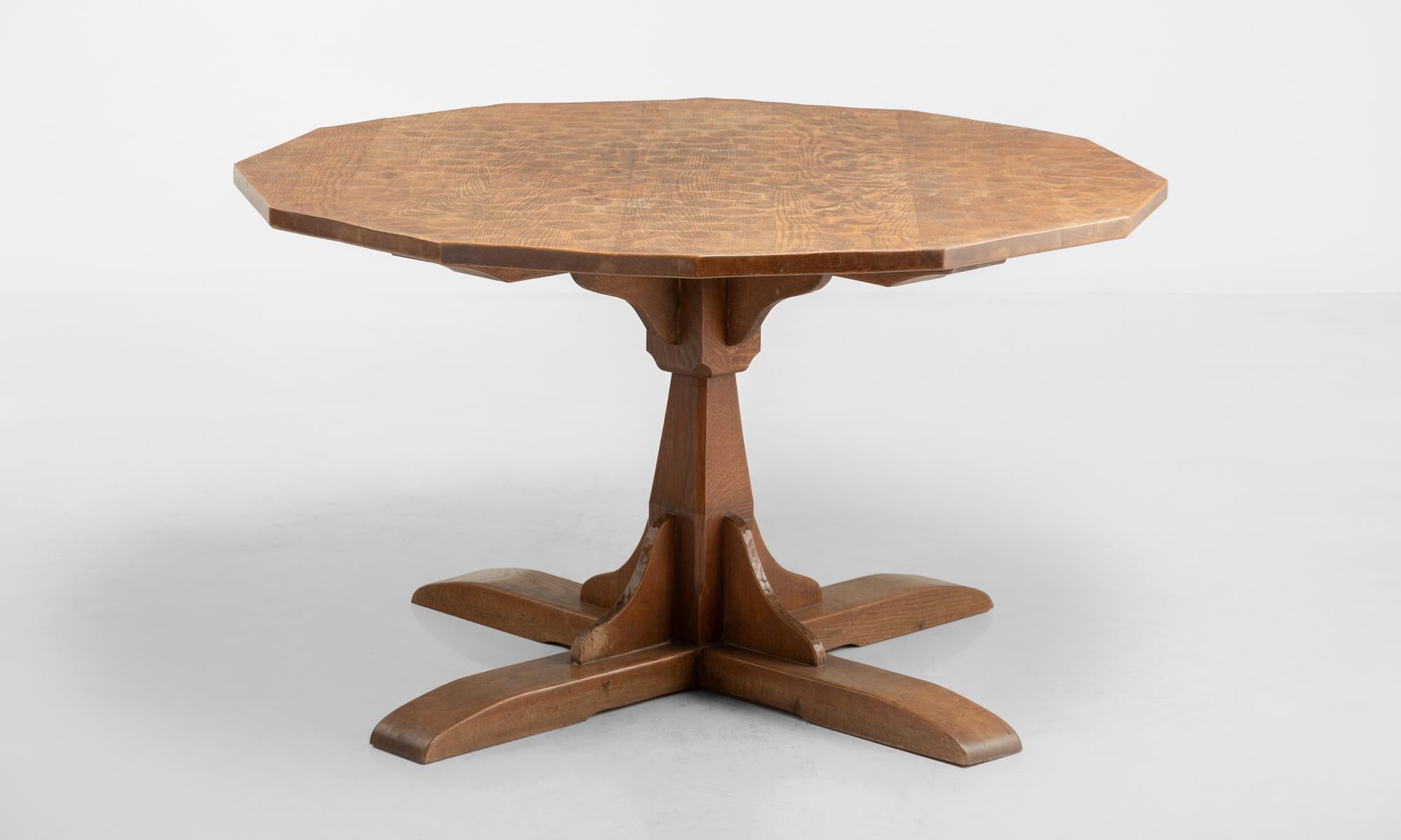 Unique form includes a twelve sided table top with subtle carved pattern motif.

Made in England circa 1930.