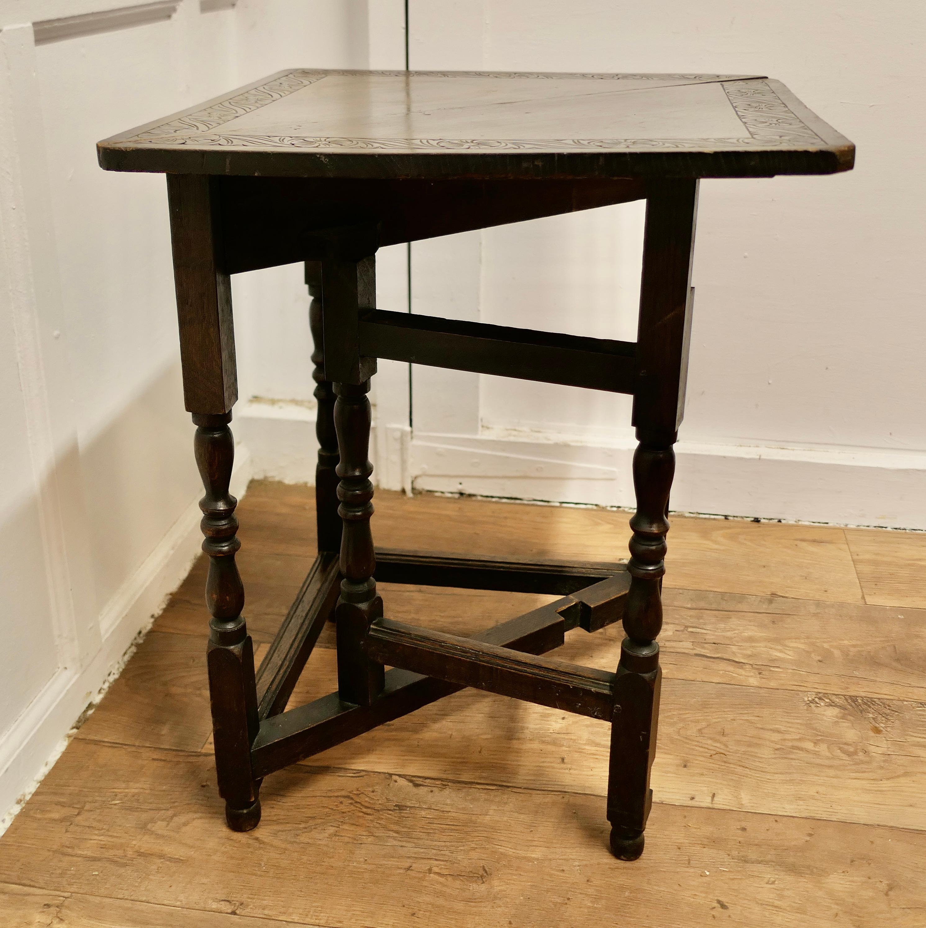 Early 20th Century Carved Oak Triangular Gate Leg Side Table    For Sale