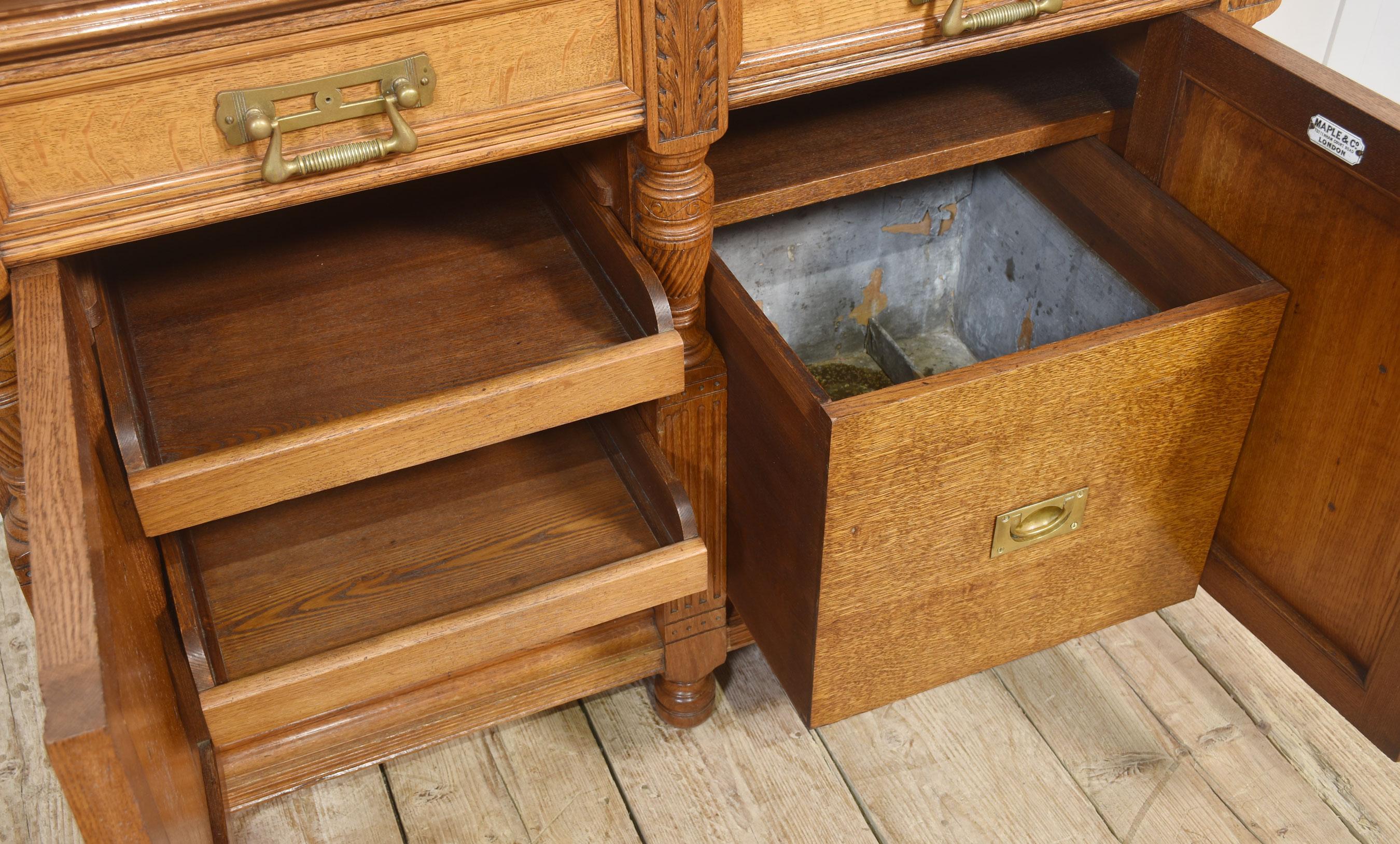 Oak Carved oak two door sideboard by Maple and Co For Sale