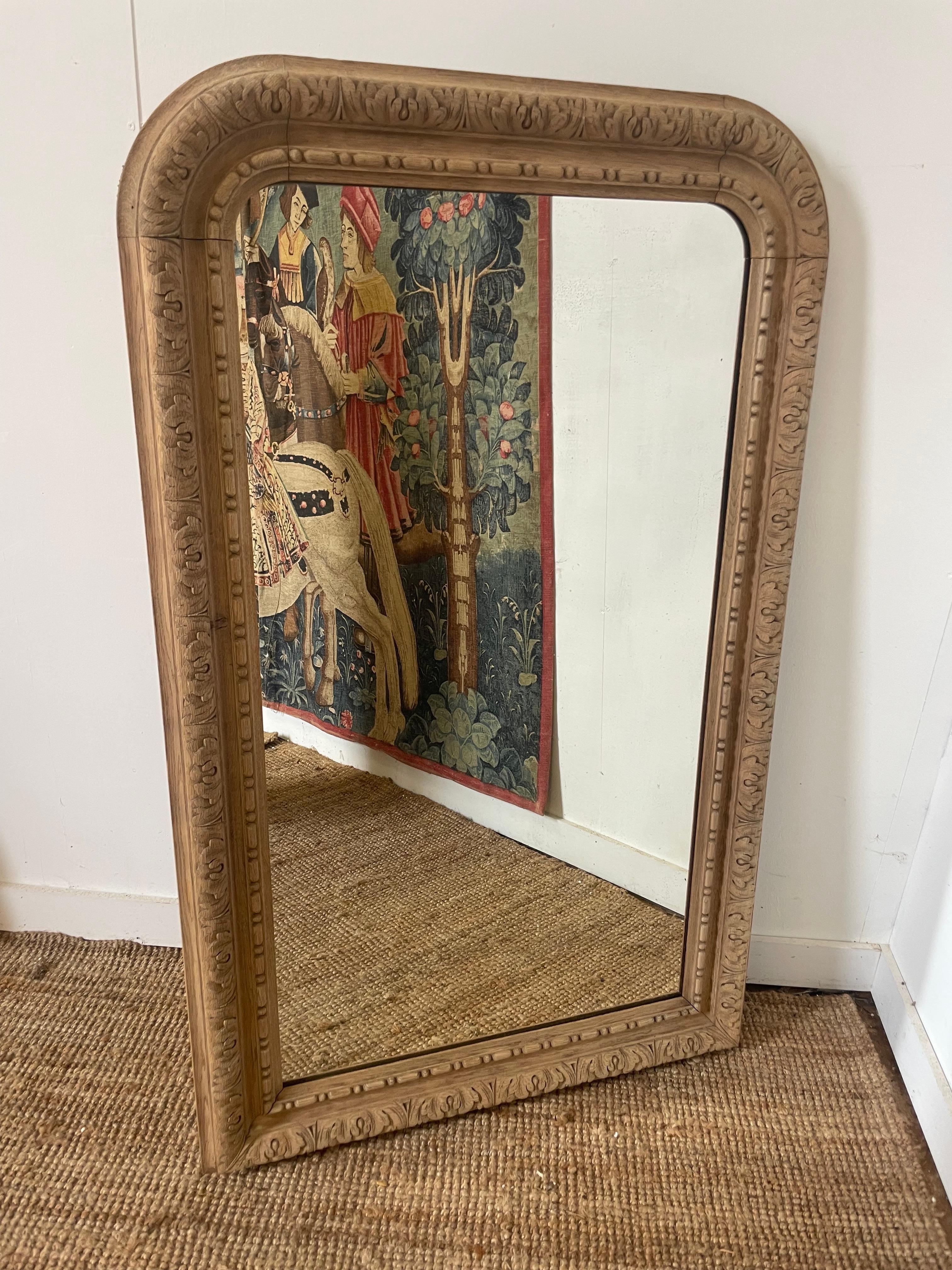 Decorative 19th century French carved oak arched topped wall mirror 

French circa 1880's with original mirror and backboards 

This piece has been washed and scrubbed to give it a contemporary feel , we do not use harsh chemicals ( bleach ) when