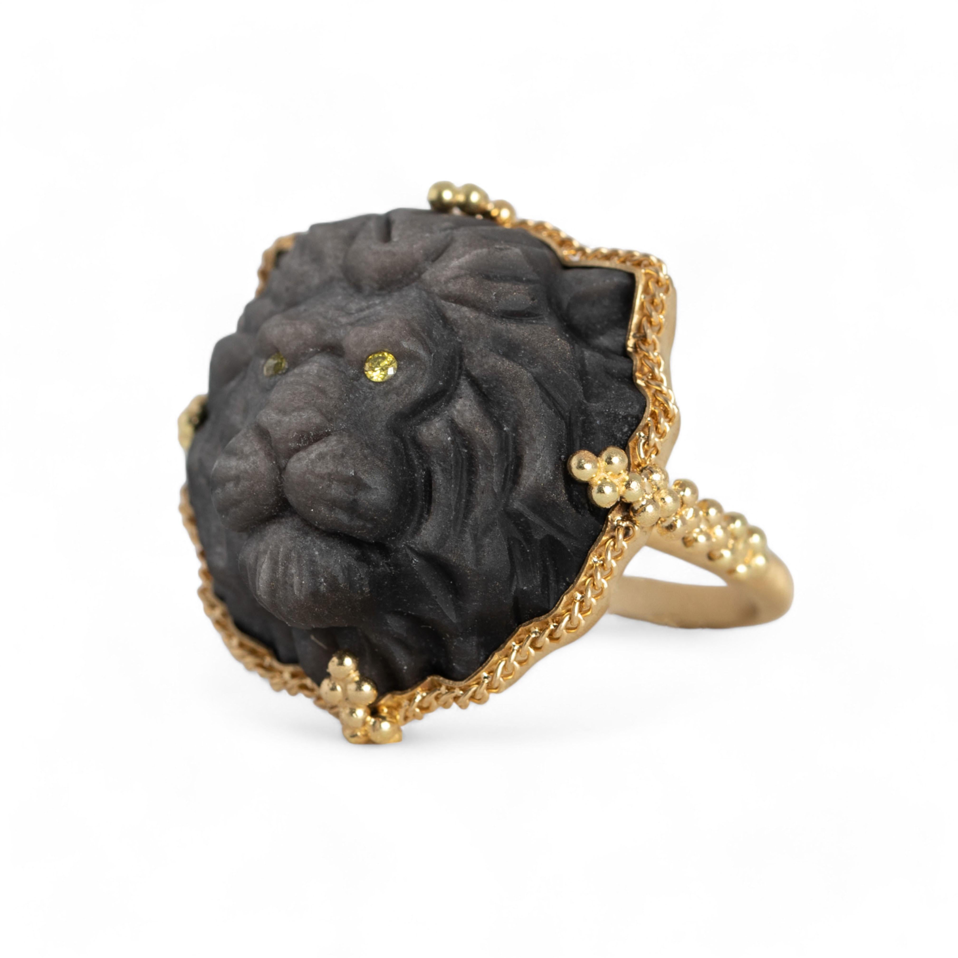 This matte black Obsidian was hand-carved into a magnificent, powerful lion and brought to life by intricate detail with a thick, furry mane and glowing yellow Diamond eyes. This king of the jungle embodies strength and courage, and is rightfully