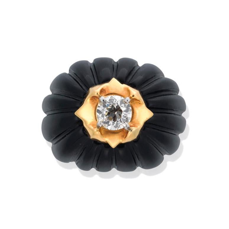 Gorgeous hand crafted 18k Yellow Gold and Platinum ring. This amazing vintage ring is one of a kind. Highlighting this piece is a hand carved Onyx gemstone perfectly carved to fit this ring, Centered in this carving is a natural Brilliant Round Cut