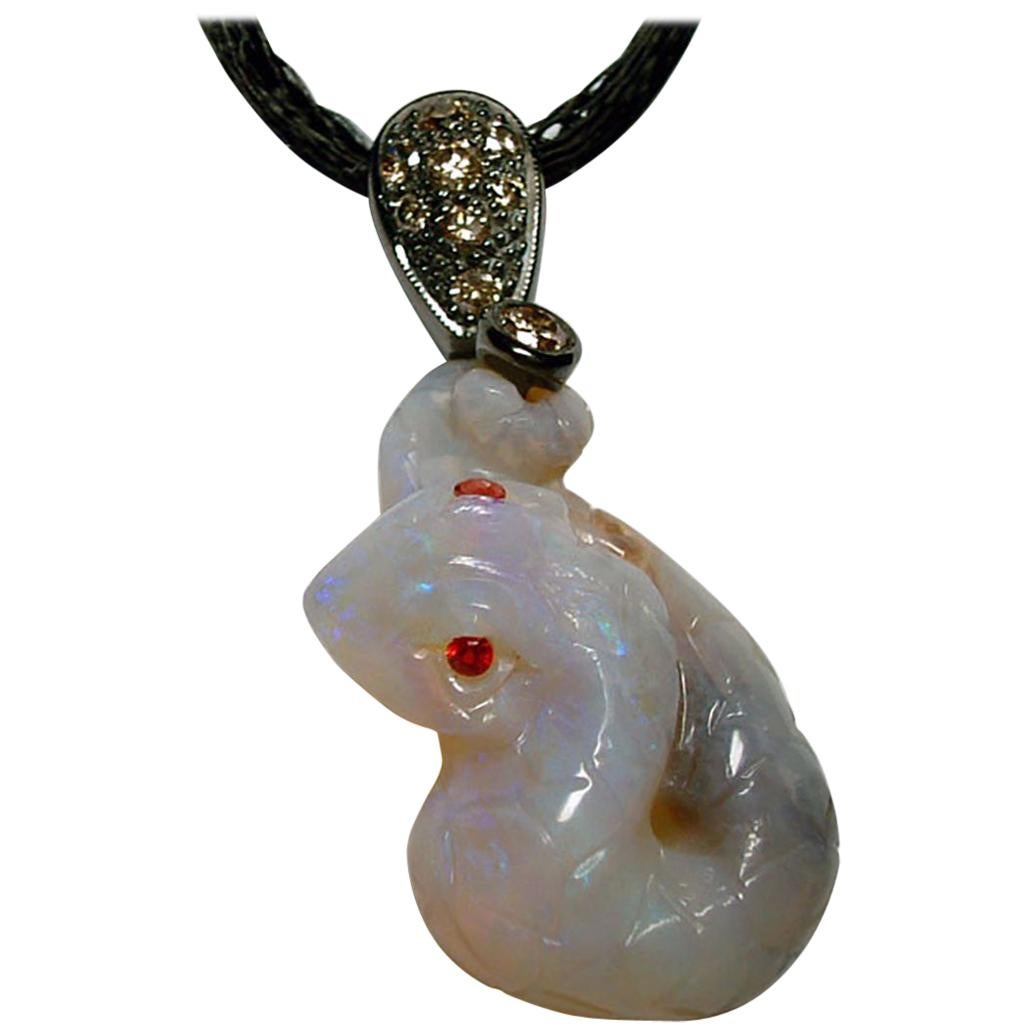 Opal Snake Pendant Set with Coniac Diamonds and Red Sapphires For Sale