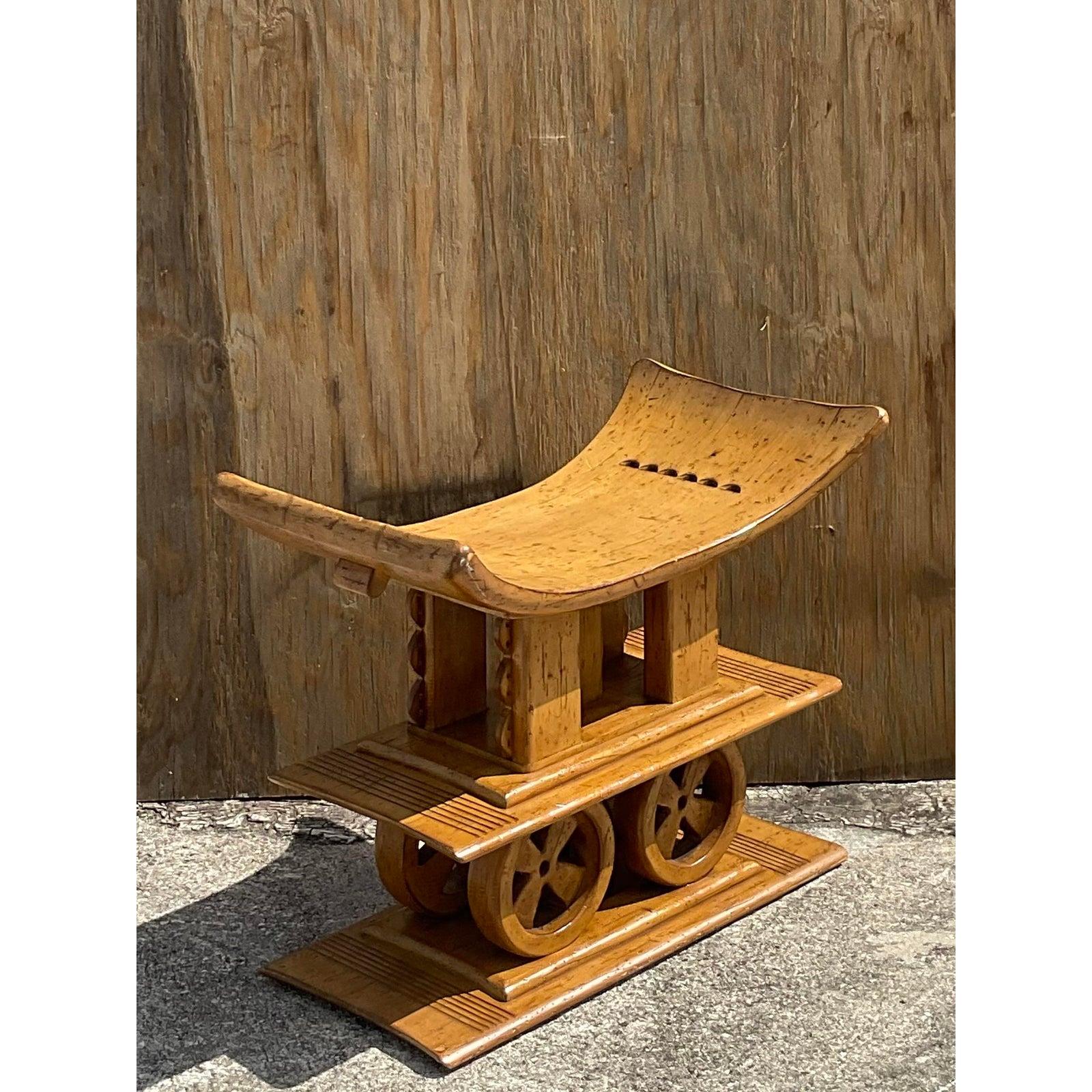 Fantastic Boho vintage carved stool. Done in the style of the classic African Ashanti stools with a Contemporary twist. A beautiful double stack and a slightly larger profile make this a very versatile stool. Acquired from a Palm Beach estate.