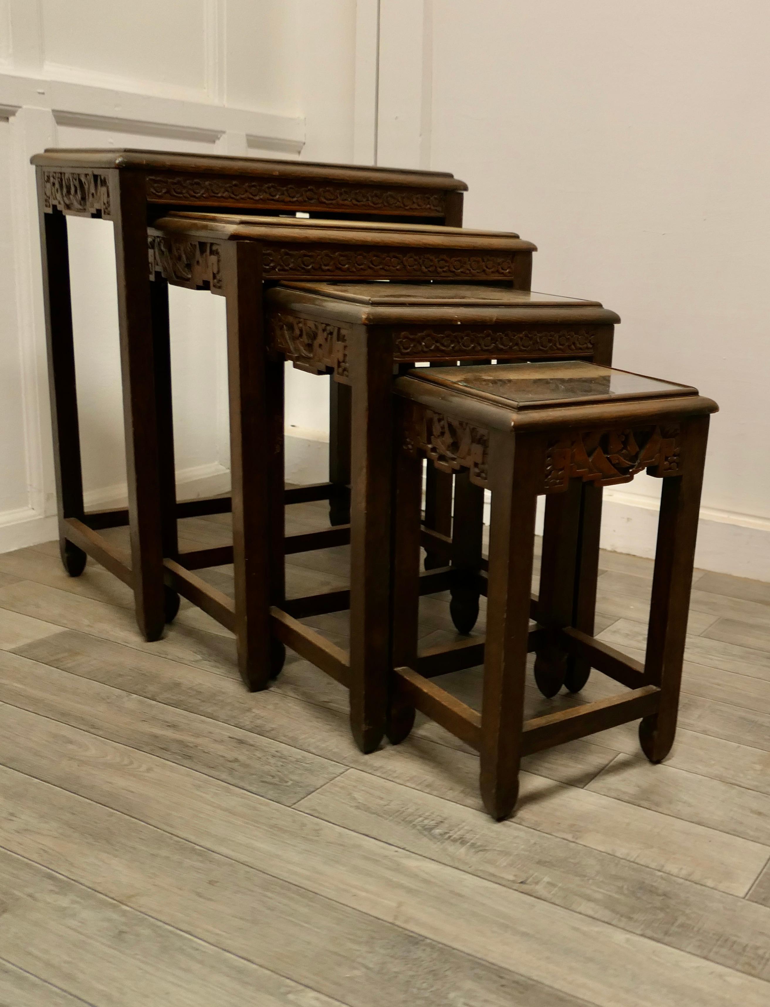 Carved oriental nest of four tables


This is a very Good-looking set of tables, with attractive carved scenes on the top and sides, all 4 tables are sound and in good condition they have inset glass tops which have kept them looking good
As