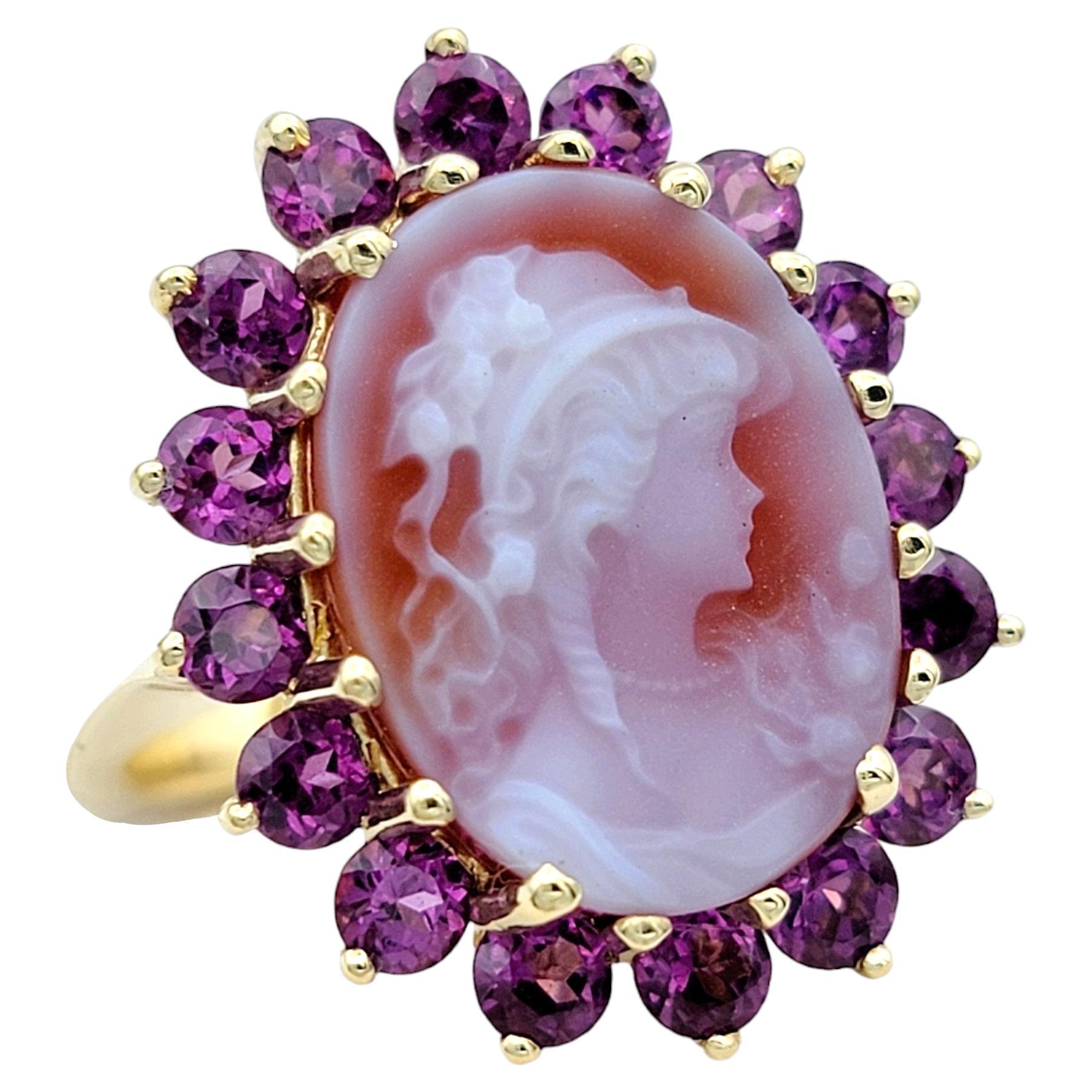 Ring Size: 6.5

This exquisite cameo ring is a testament to classical elegance, set in lustrous 14 karat yellow gold. The focal point of the ring is the intricate cameo carving, showcasing intricate details and timeless beauty of a young woman's