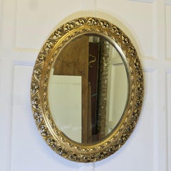 Carved Oval Gilt Wall Mirror    This is a very attractive Mirror
