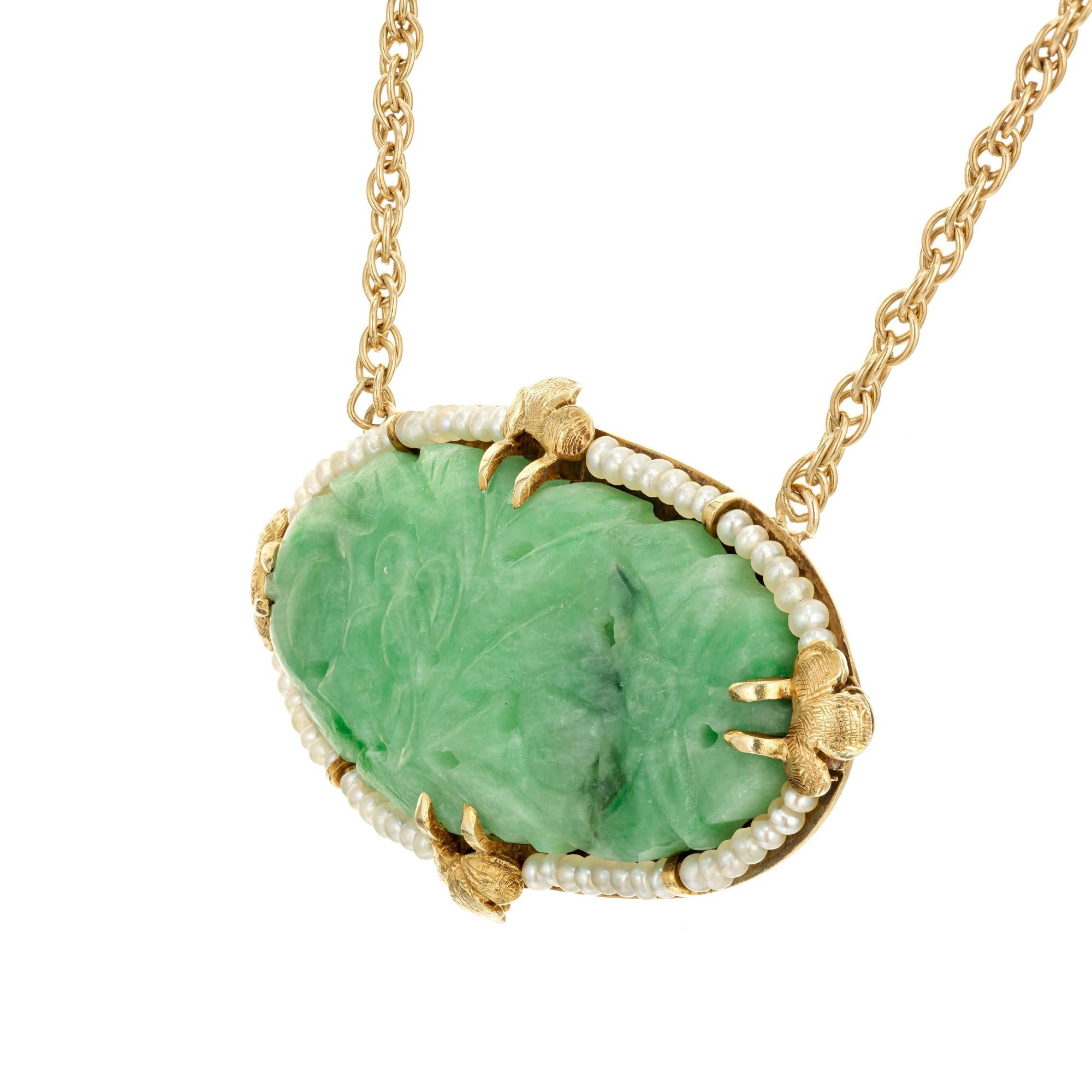 Early 1900's Natural Jadeite Jade carved oval pendant necklace with no enhancements. AGL certified mottled green with a halo of  natural pearls. Handmade frame. 14k yellow gold 17 inch rope chain. 

AGL certified # CS44803 natural Jadeite Jade 37.7