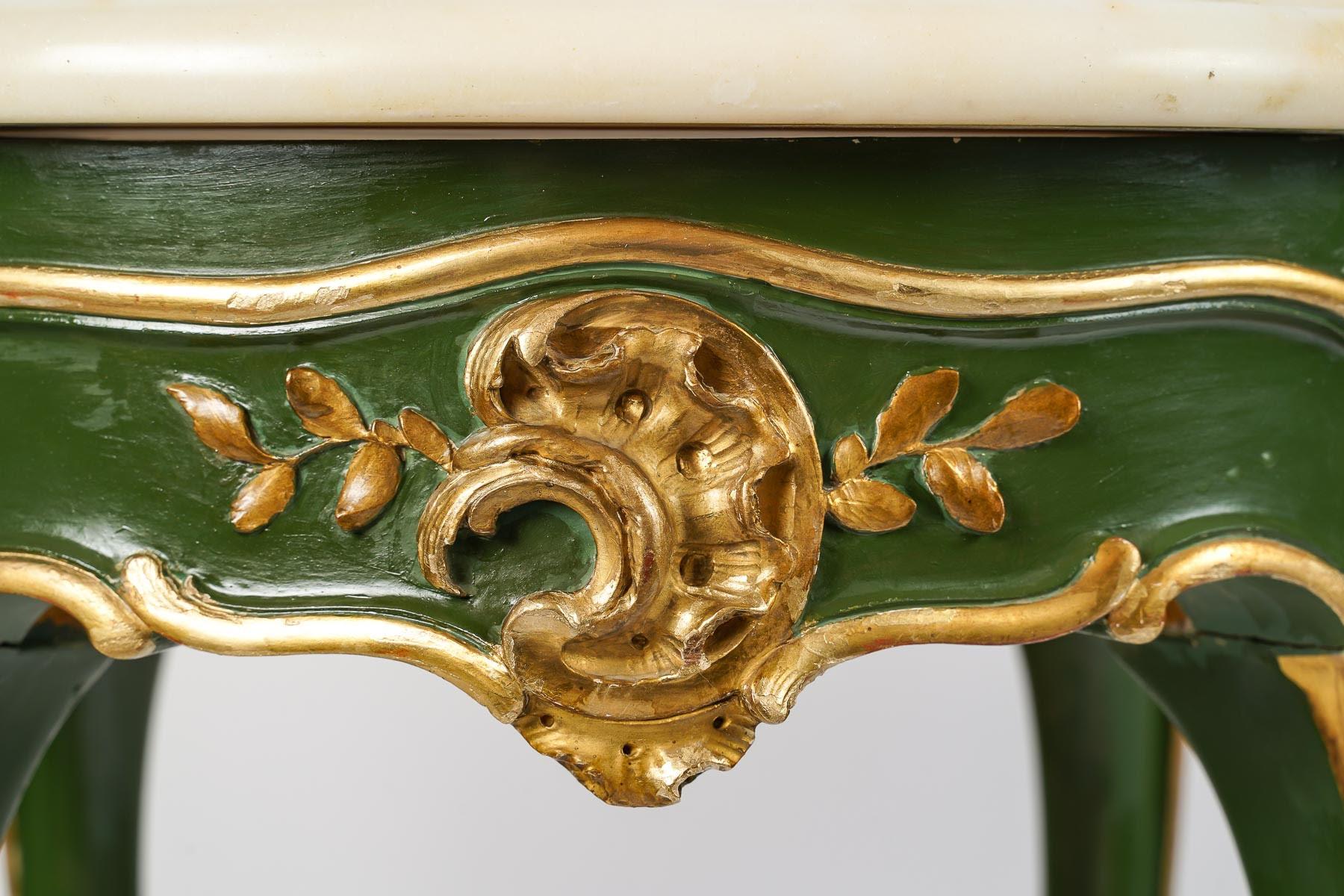 Carved, painted and gilded wood pedestal table, Louis XV style.

Table, pedestal table in carved, painted and gilded wood, marble top, Louis XV style, 20th century.
h: 77cm, d: 51cm