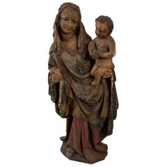 Geschnitzte und bemalte Figur einer Madonna mit Kind