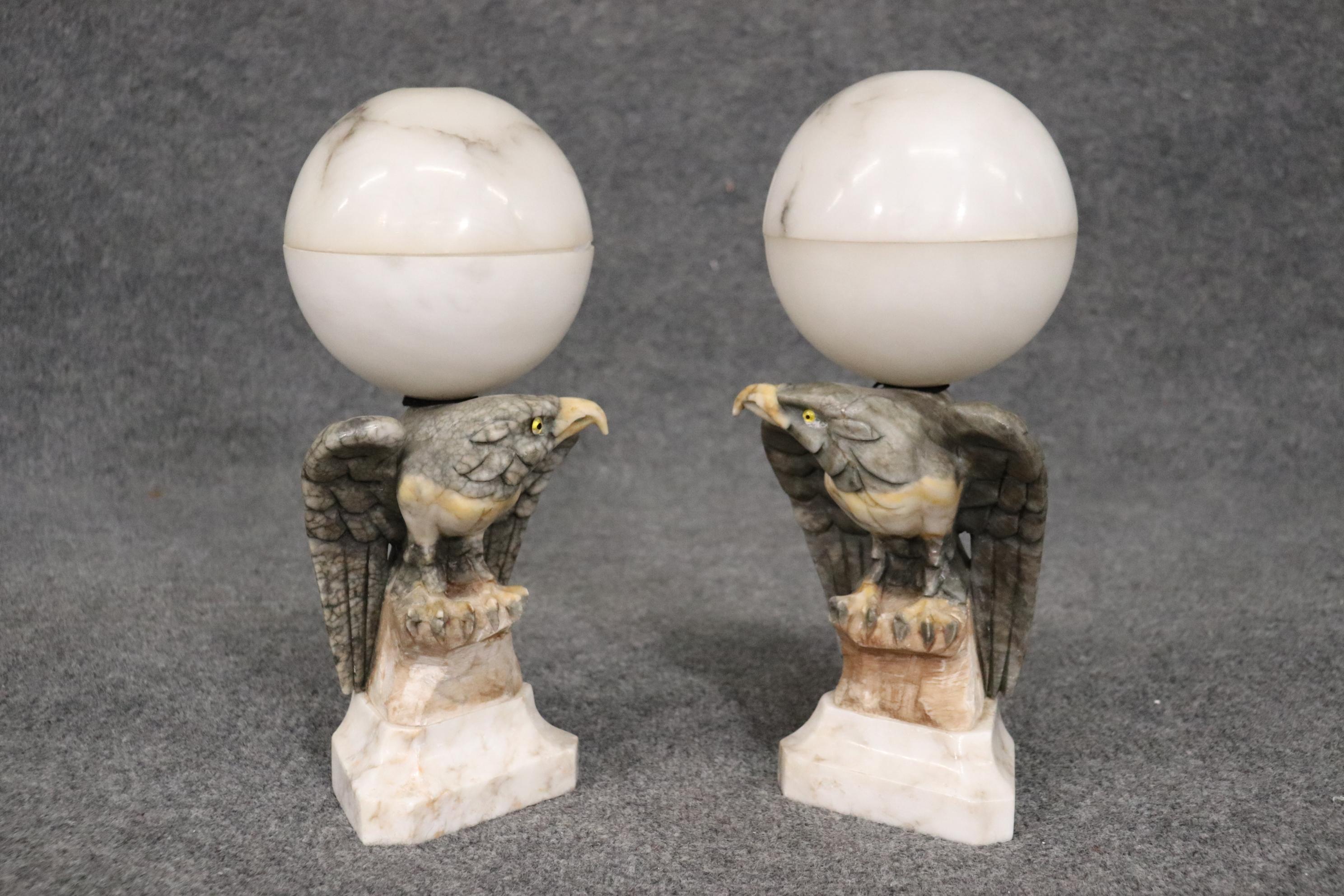 This is a beautfiul pair of carved alabaster eagles that were originally wired for use as a pair of table lamps. They don't have wiring and are in very good condition and can be used as lamps or sculptures. They each measure 5 x 6 x 14 tall.