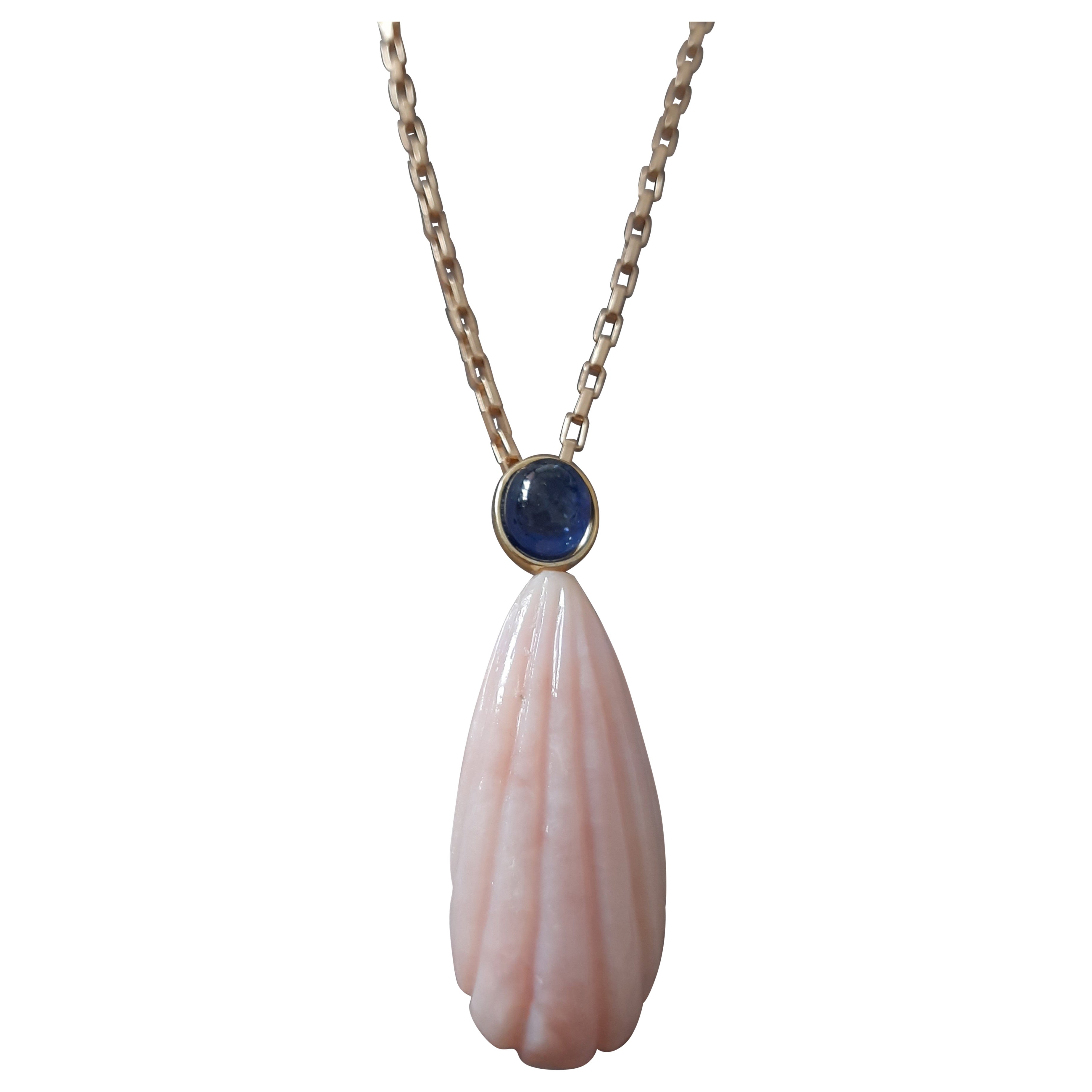 Carved Pear Shape Pink Opal Pendant With Blue Sapphire Cab Set In 14k Gold Bezel For Sale