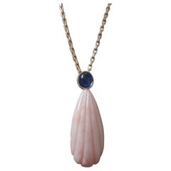 Carved Pear Shape Pink Opal Pendant With Blue Sapphire Cab Set In 14k Gold Bezel
