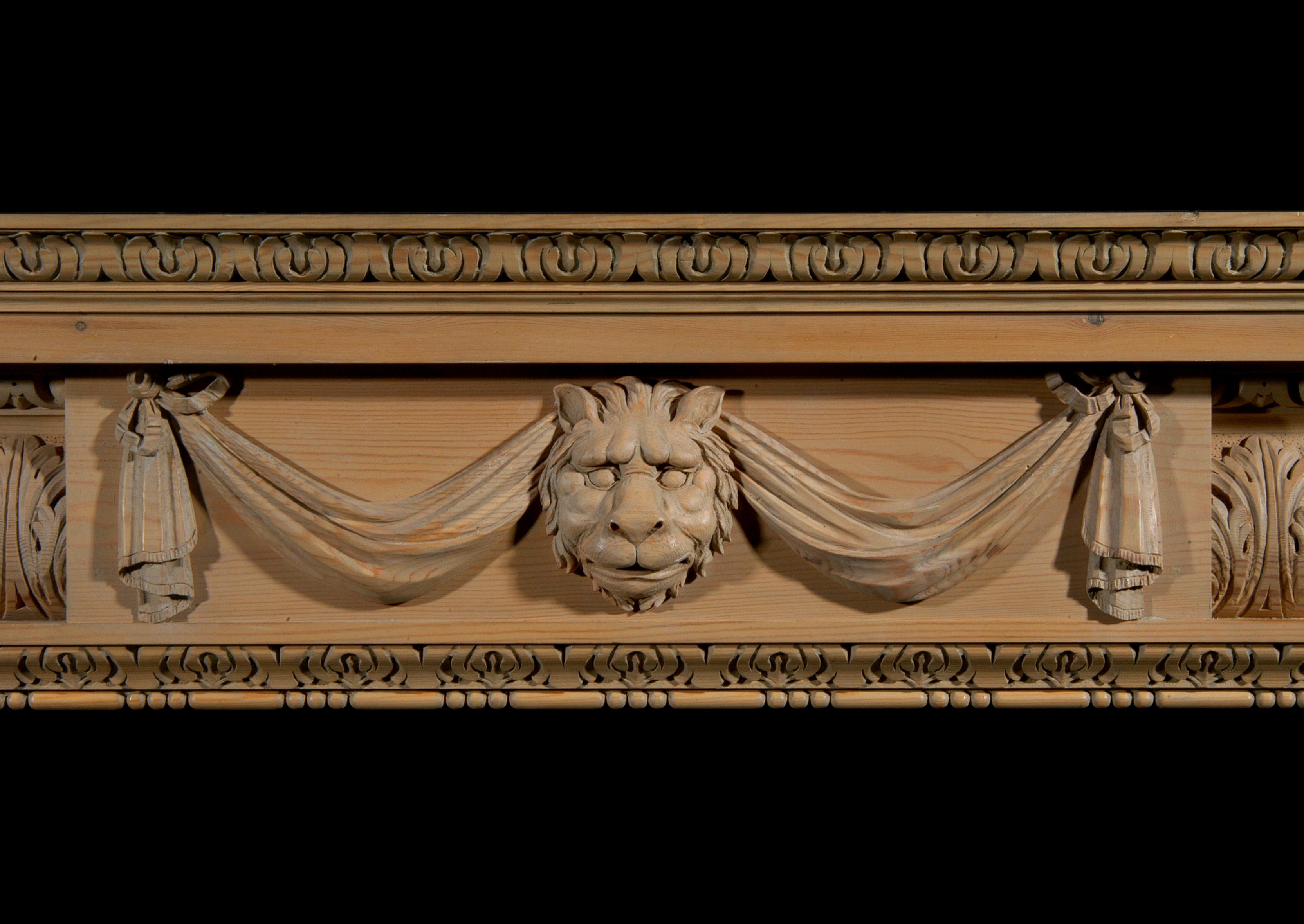 George II Carved Pine Fireplace with Lion's Mask and Drapery For Sale