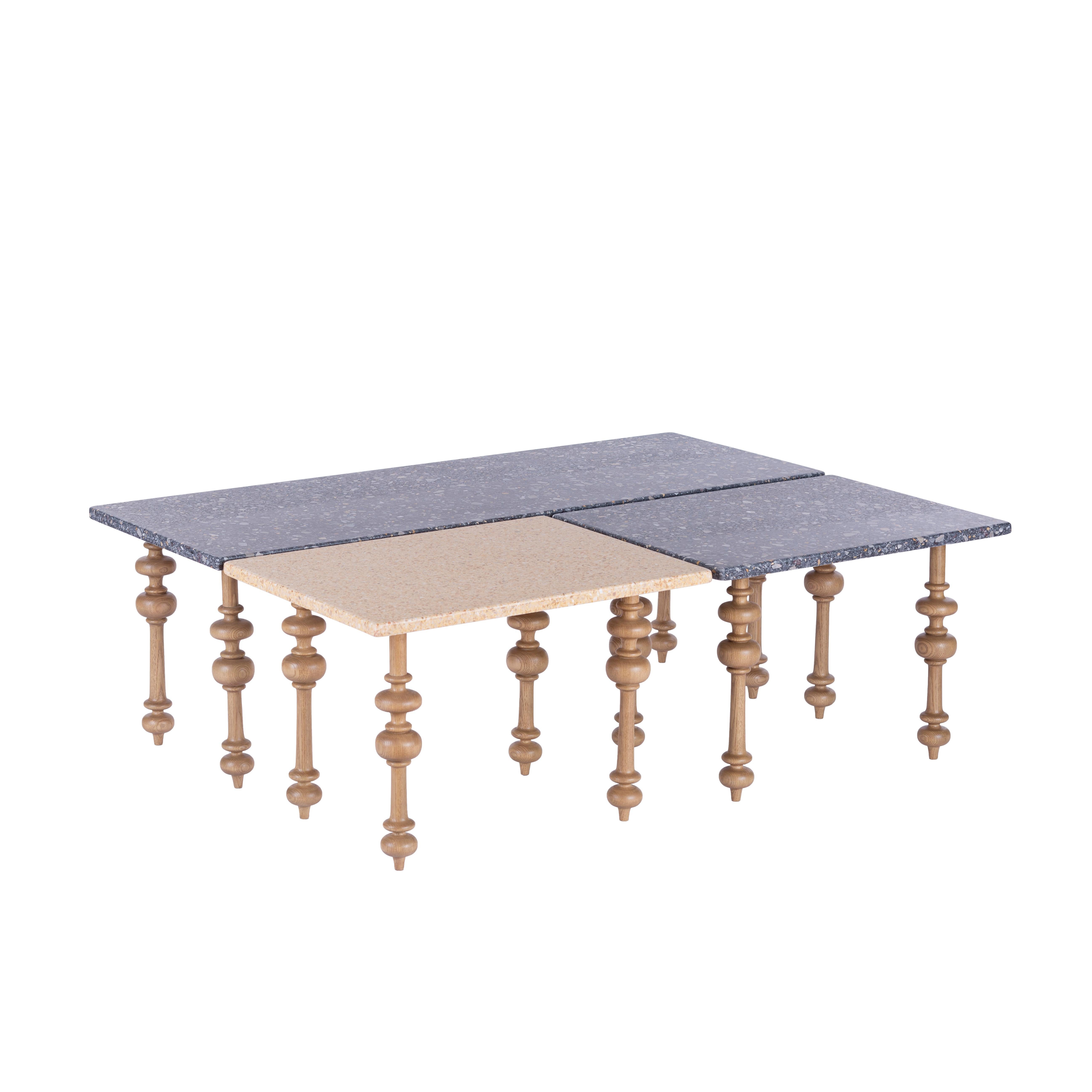 Carved Pitch Pine Outdoor Coffee Table with Italian Terrazzo Tops. 
Our Terrazzo Fusion coffee table set reflects our love for mixing materials; made of Mashrabeya-inspired carved Pitch Pine legs and Italian Terrazzo tops. This fabulous coffee table