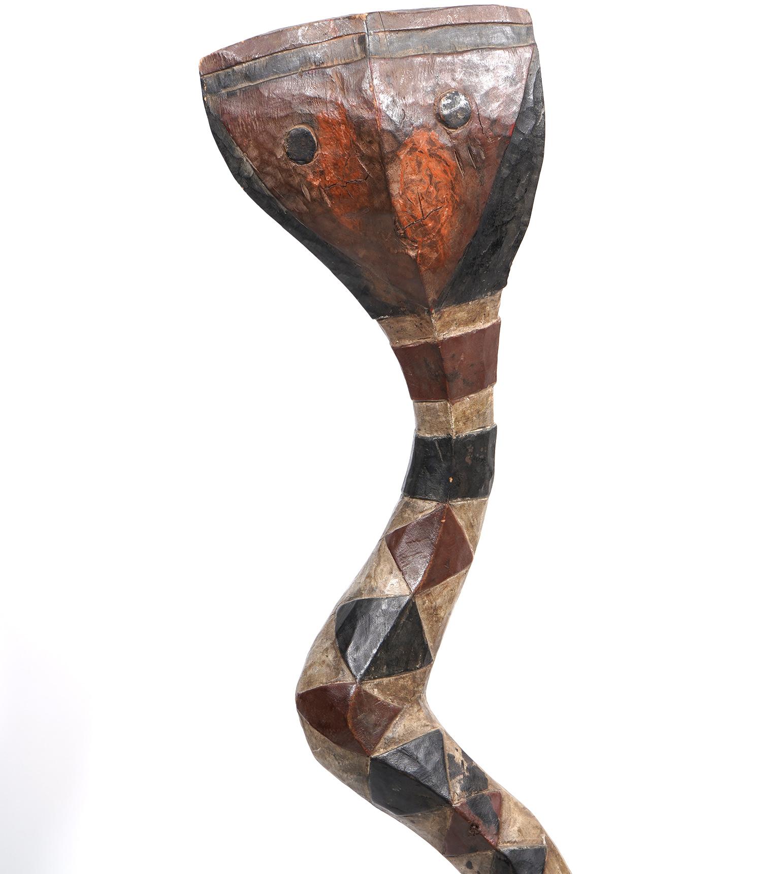 This is a Baga protective serpent, known in the literature under various names: Bansonyi, A-mantsho-na-tshol or Inap. In spite of of its aged look this particular carving is made for decorative purposes and has not been used ceremonially.
The