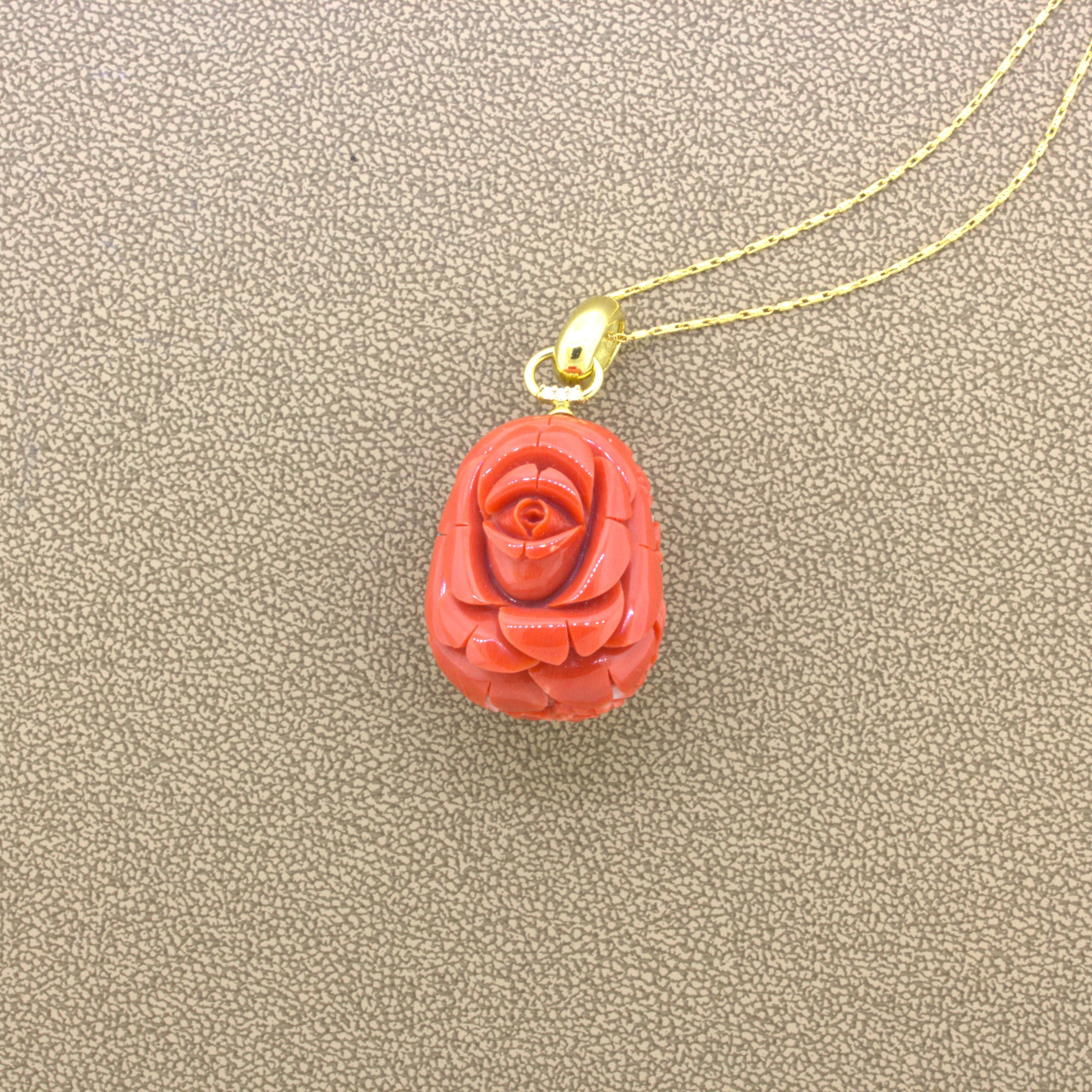 Carved Red Coral Diamond 18K Yellow Gold Floral-Motif Pendant

A chic and sweet pendant featuring a large piece of fine red coral hand-carved depicting an elegant floral motif. The entire surface of the coral is finely detailed. It is complemented