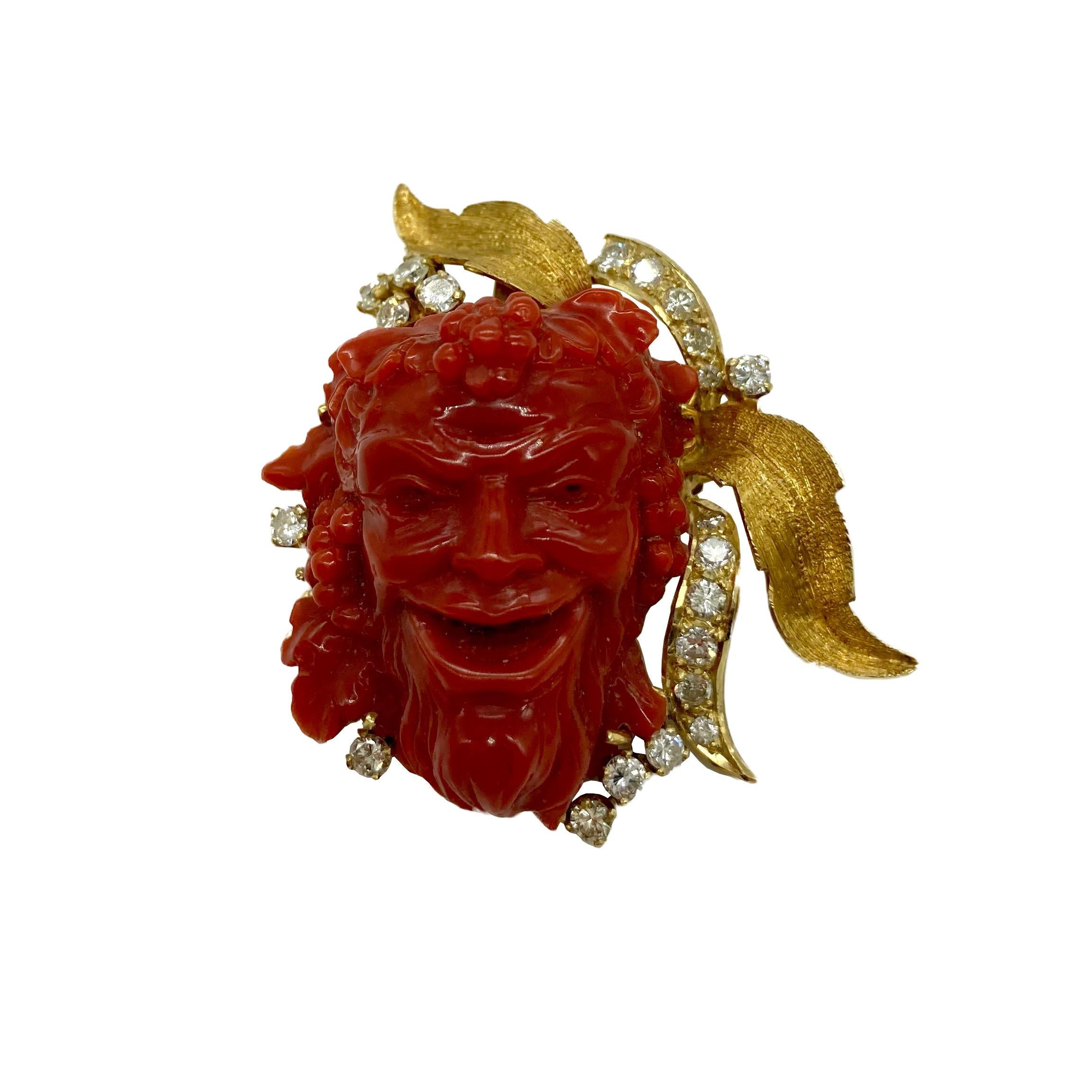 A beautiful red Italian coral brooch pendant depicting Bacchus, the Roman god of wine.  Embellished with 23 diamonds totaling approximately 1.25 carats (I-J VSI-SI) and mounted in 18 karat yellow gold. Circa 1970.