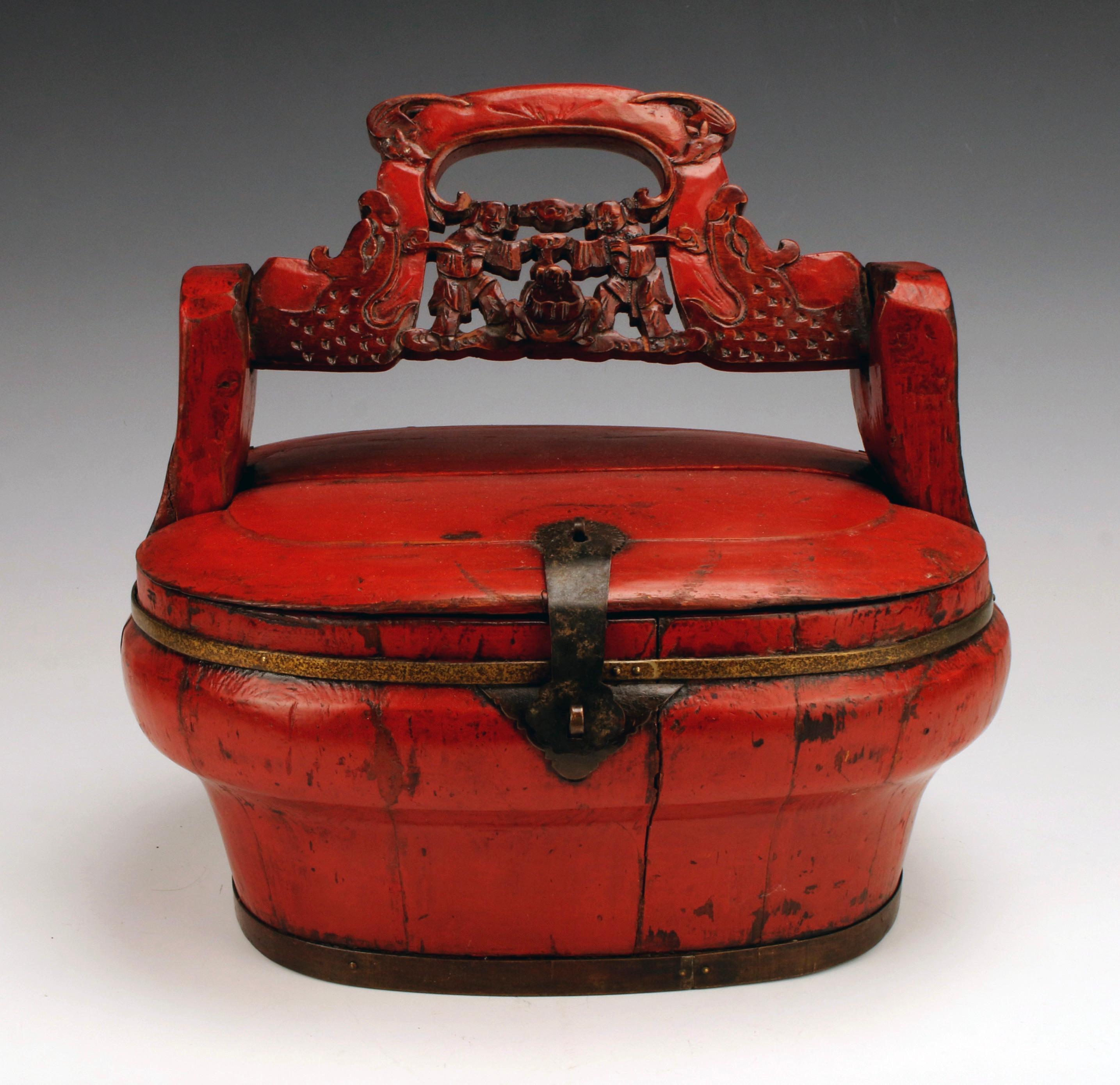 A large Chinese Red lacquer hinged basket with pierced handle. The pierced and carved handle with bats in the corners.

Measures: 13