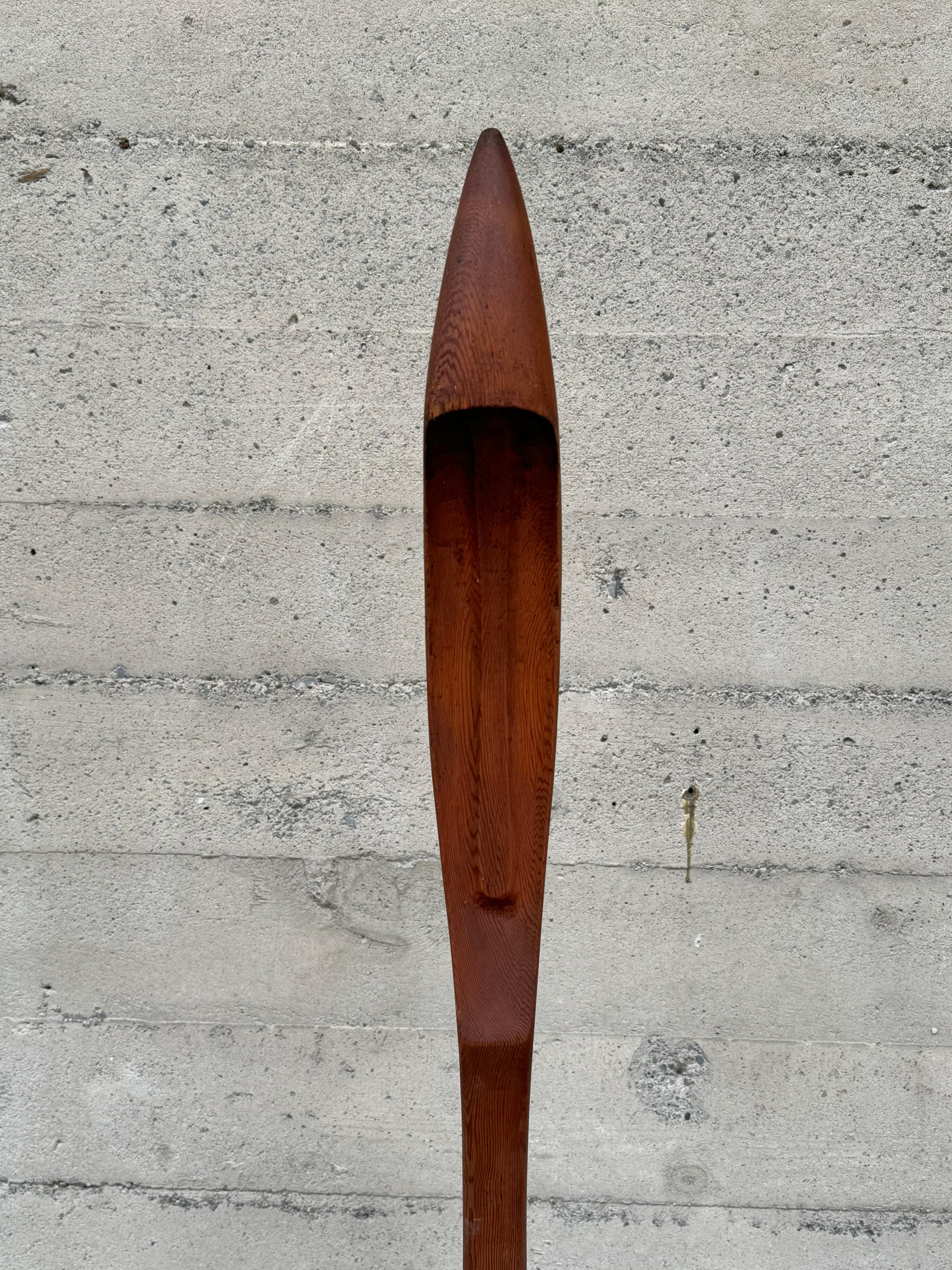 Hand carved redwood figurative abstract  totem by Bay Area artist Joseph John Hudner (1909-1971) created in 1934. Hudner attended UC Berkeley, worked for the Federal Art Project during the 1930s and had an exhibition at the SFMA in 1935. The piece