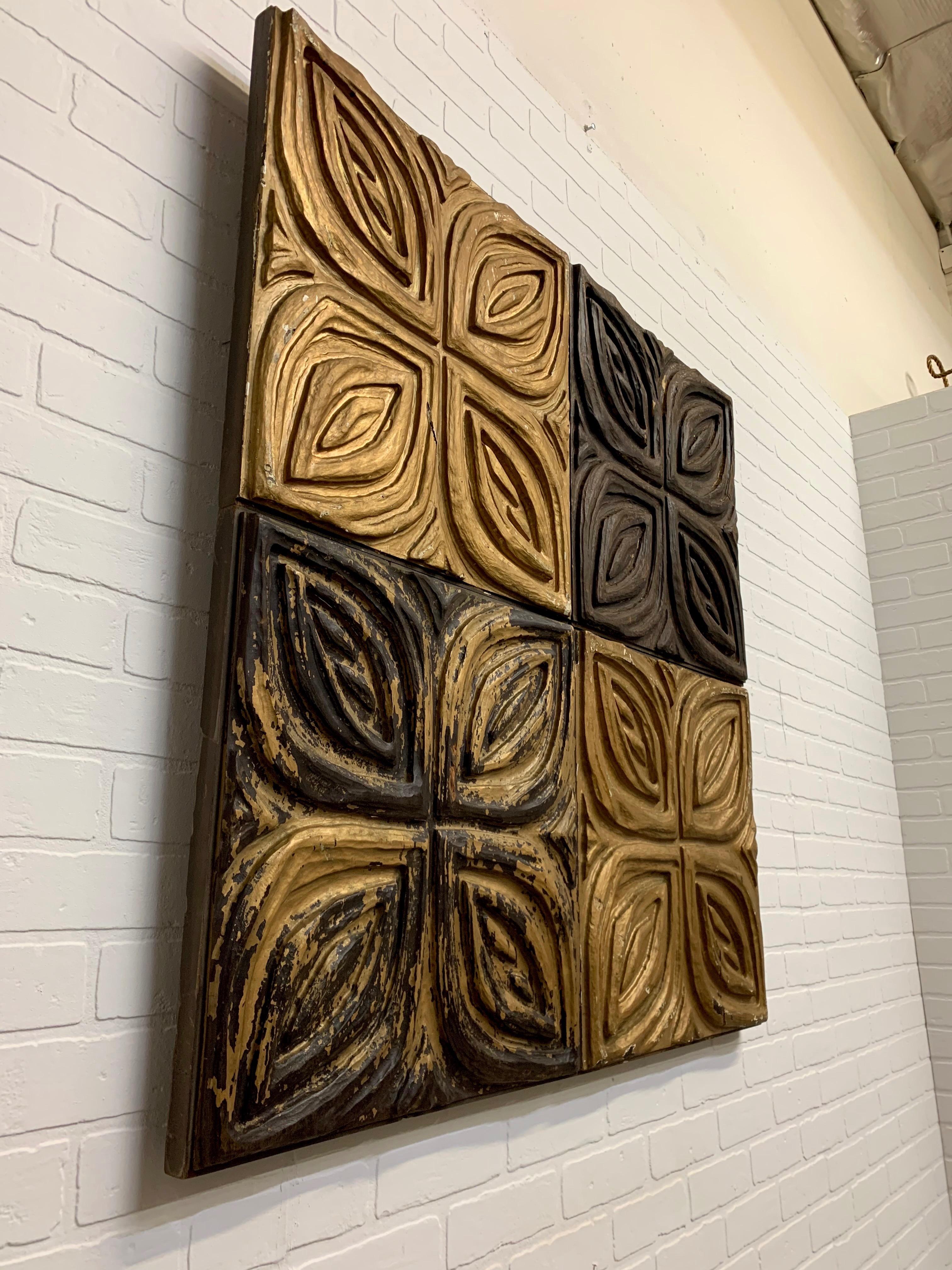 Carved redwood wall panels or sculptures by Panelcarve. Four separate panels attached to one piece of plywood. Attributed to Sheryl Brody or Evelyn Ackerman.