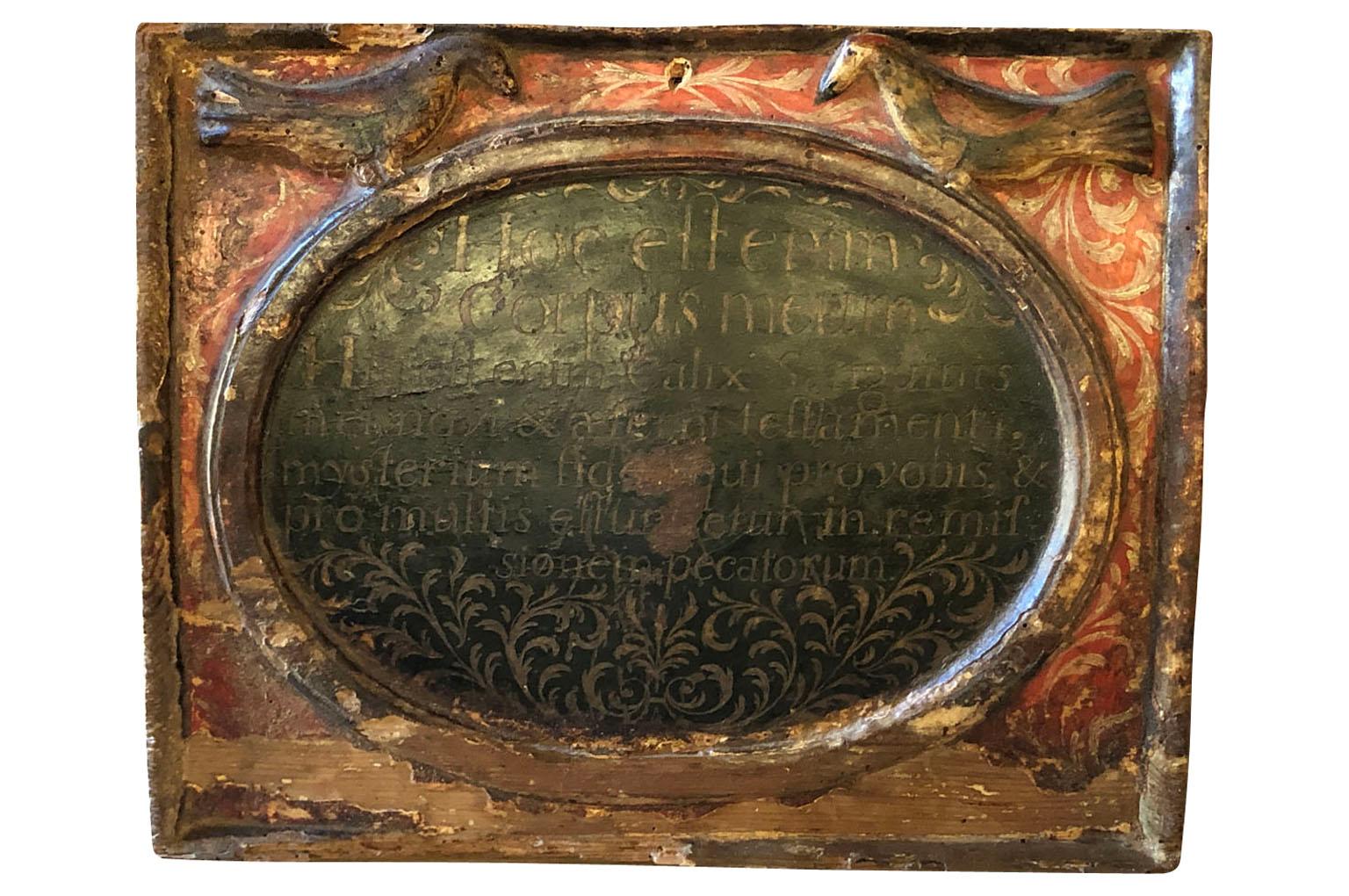 Spanish 17th century carved wood relief of the Consecration of the Holy Body of Christ in the Eucharist. The Latin inscription translates 