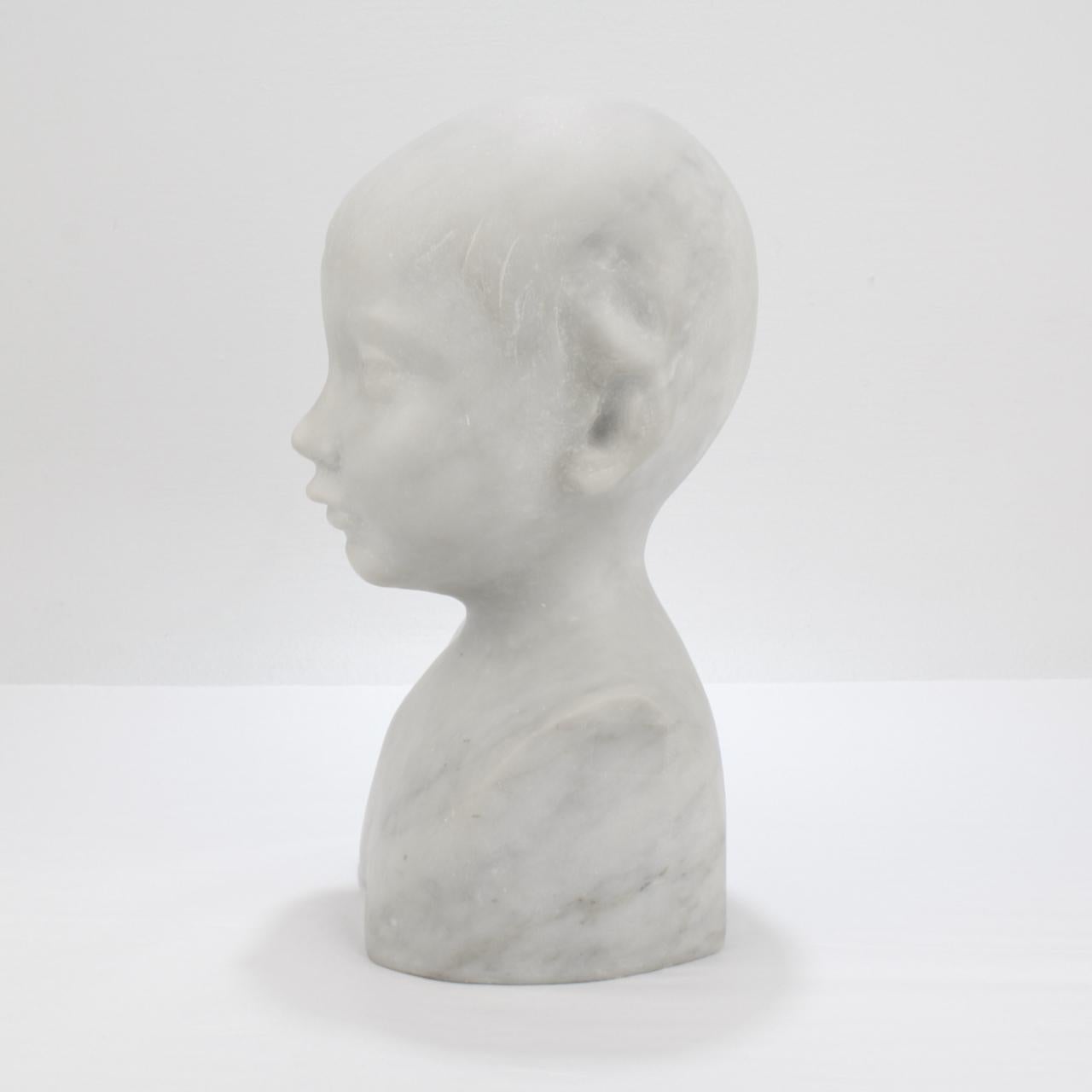 Unknown Carved Renaissance Style Cararra Marble Bust of a Child after Desiderio For Sale