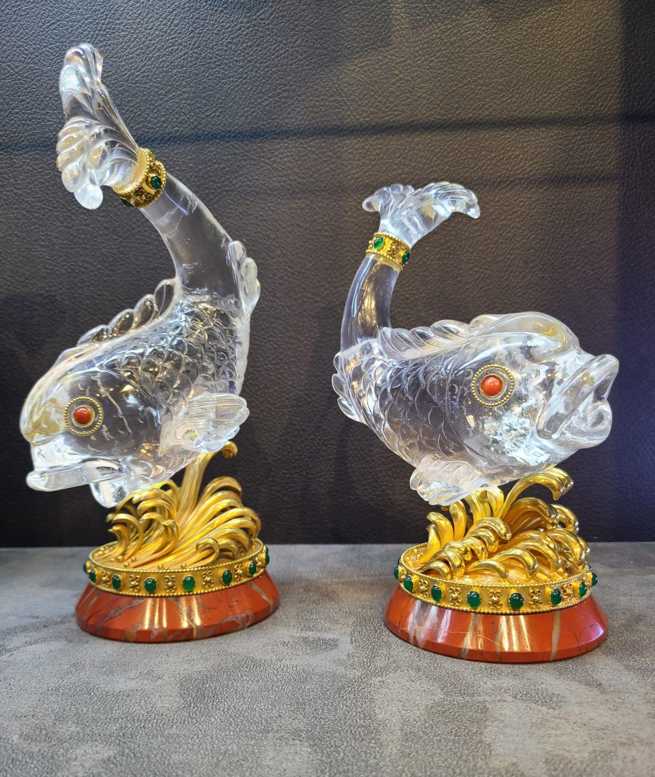 Carved Rock Crystal Fish Desk Objects by Boucheron A pair of rock crystal and gem set table ornaments, circa 1970
Designed as a rock crystal carp upon a jasper plinth with cabochon chrysoprase and coral
Signed Boucheron.

Measurements: 