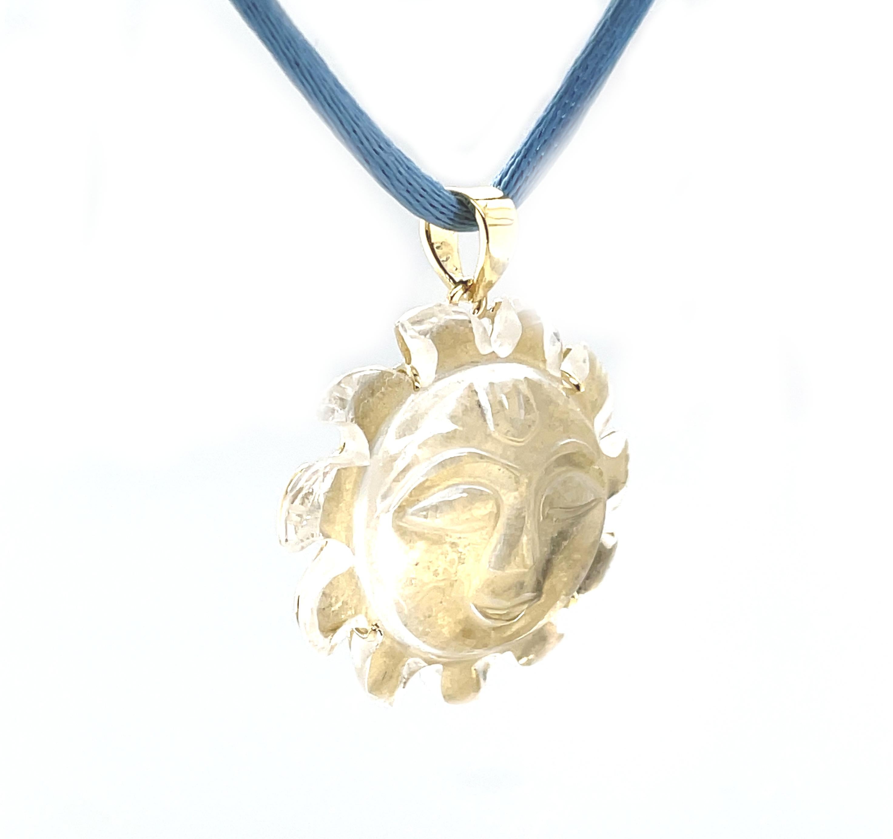 This cheerful necklace features a large rock crystal gemstone that has been beautifully hand carved as a smiling 