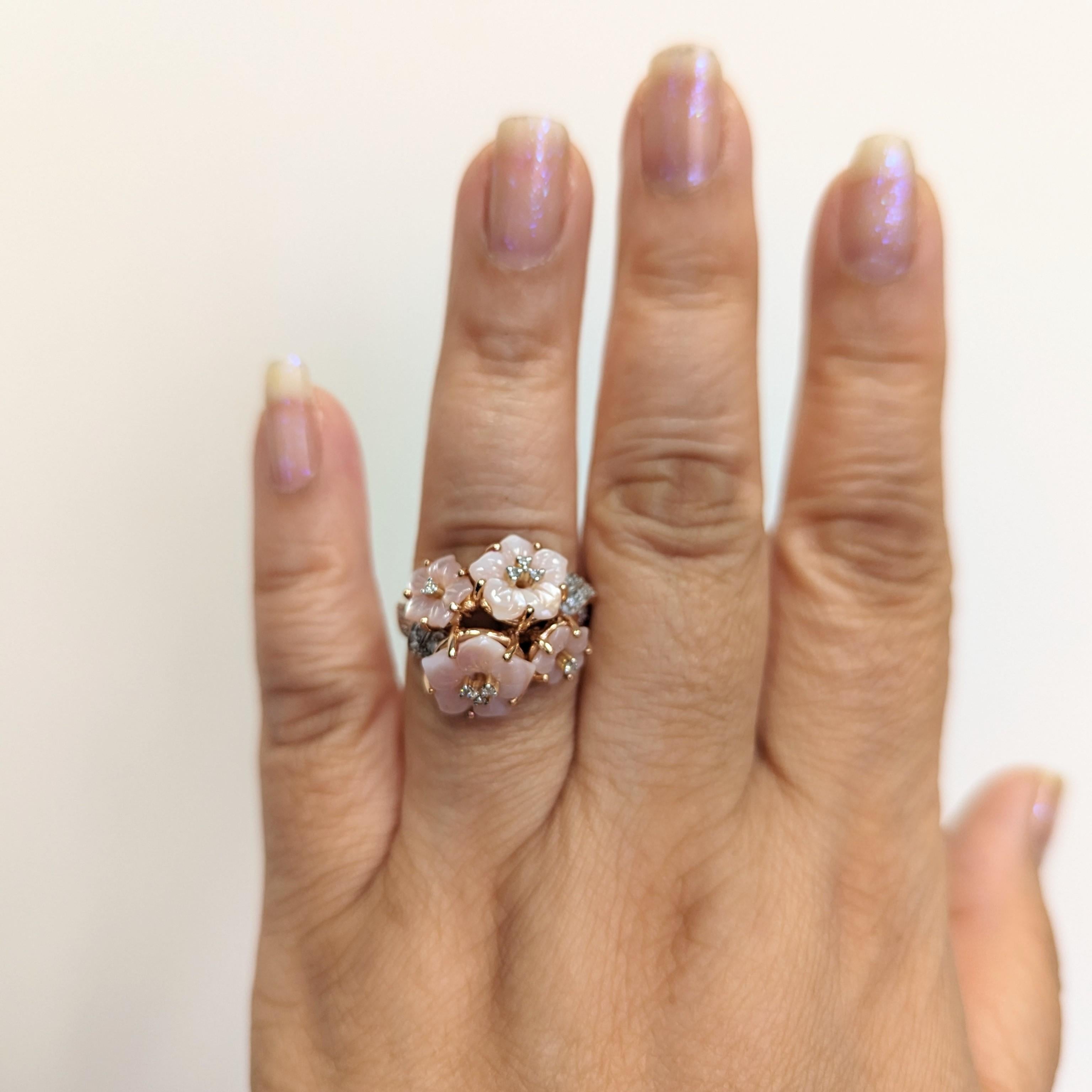 Beautiful carved rose quartz and 0.10 ct. white diamond rounds.  Handmade in 14k yellow gold.  Ring size 10.25.