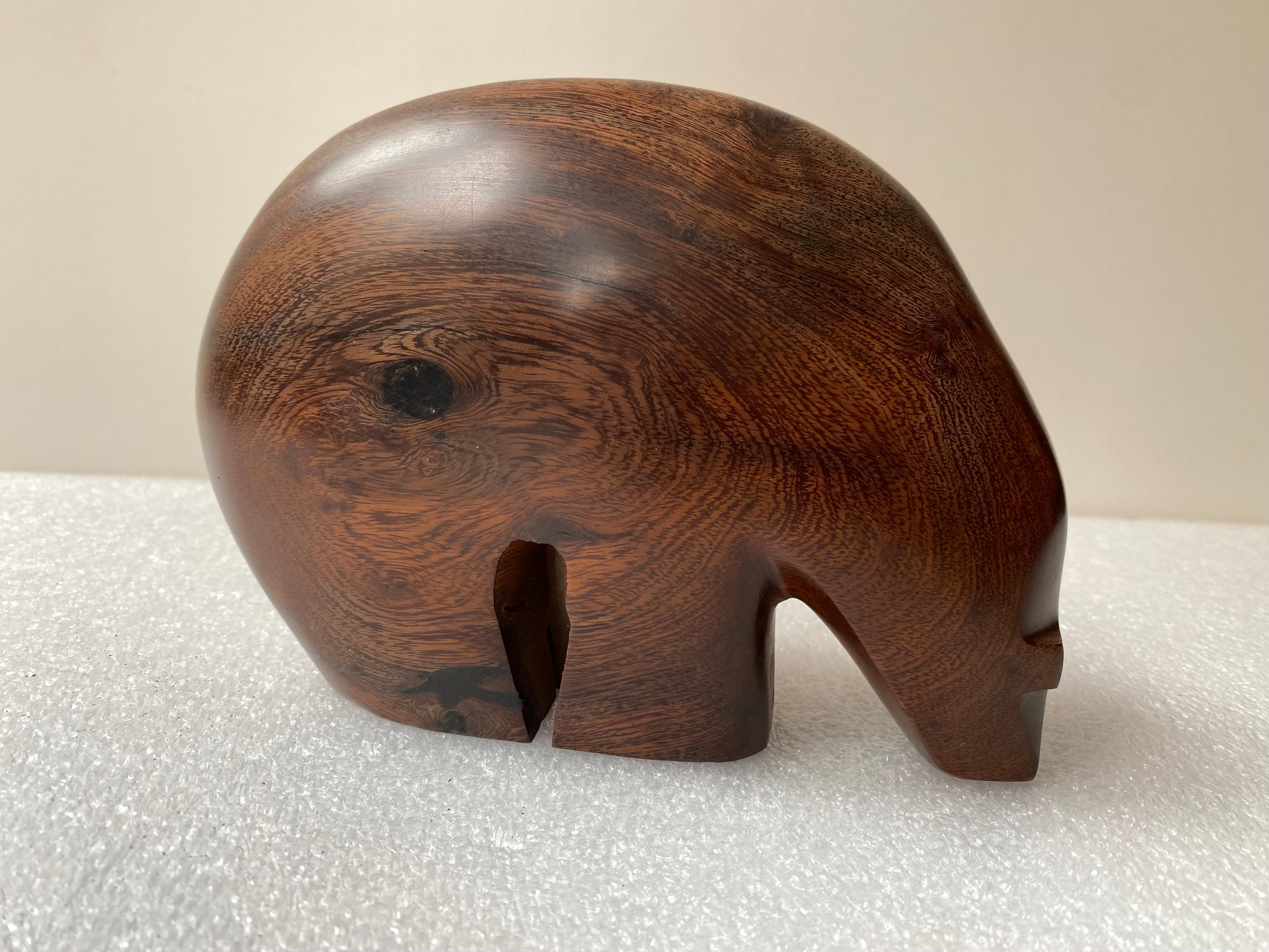 Rosewood carved polar bear possibly by Thomas Suby, purchased with another piece from a house that is a carved duck that is signed. Beautiful Wood and nice simple shape.