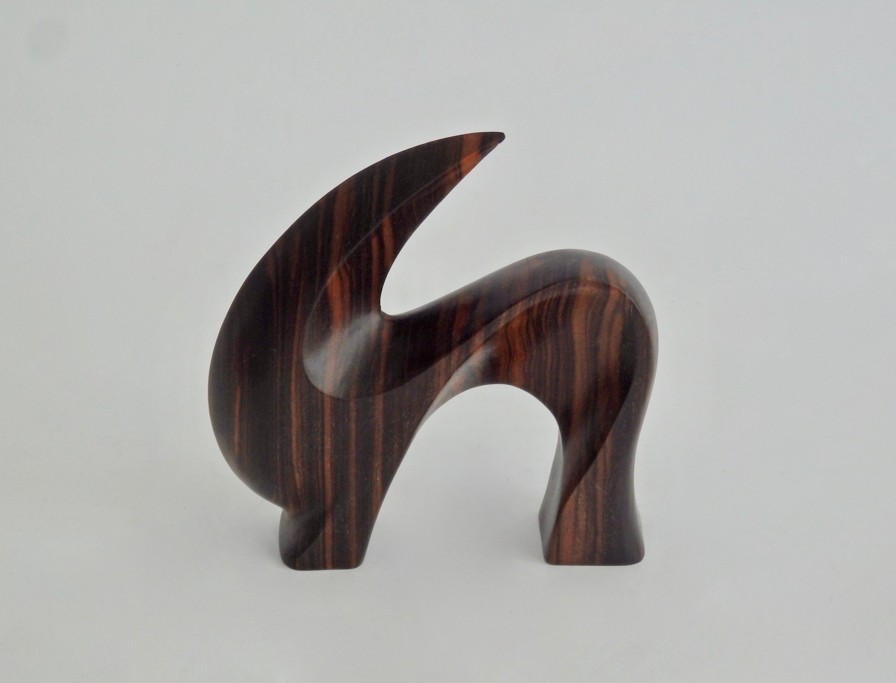 An aesthetically charming antelope sculpture in rich grainy rosewood. Both effortless and valiant despite its diminutive size.
Measures: 5.13