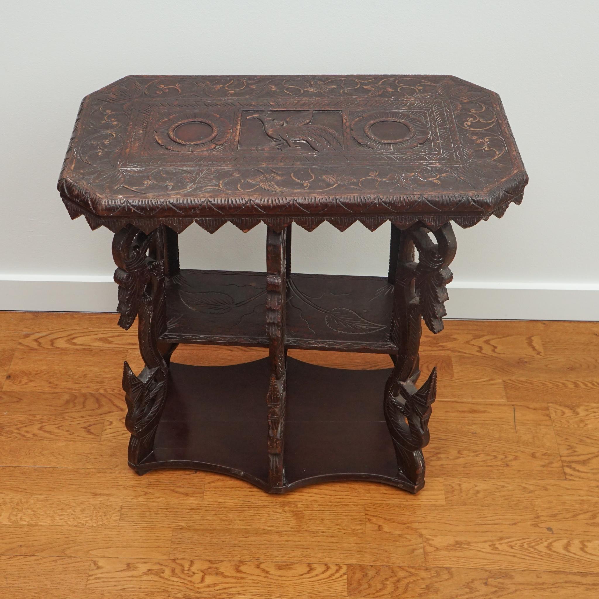 This exquisite Yala accent table is from Ceylon, circa 1871. Made of rosewood, the intricately carved legs and top surface make it truly unique. The table is in very good condition and exhibits a beautiful age-worn patina.