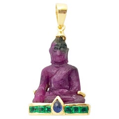 Carved Ruby, Cabochon Blue Sapphire and Emerald Buddha Pendant set in 18K Gold