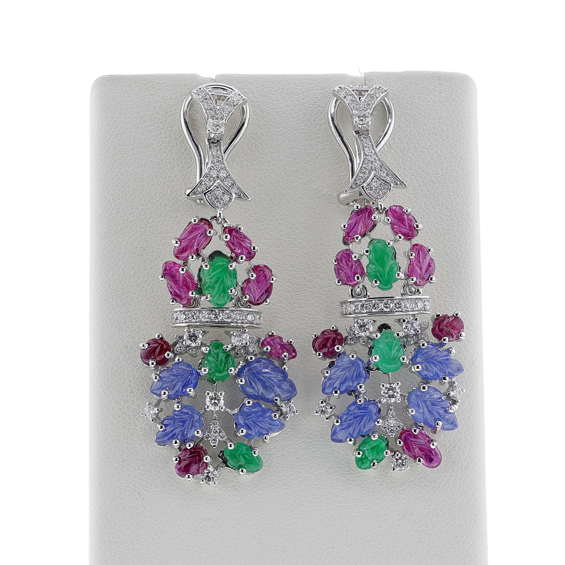 A pair of royal Carved Ruby, Emerald, Sapphire and Diamond Dangling Earrings made in 18K Yellow Gold. The earring has 17.50 carats of ruby, emerald, and sapphire; 1.13 carats of diamonds. The total weight of the earring is 17.94 grams.



SKU: 1481