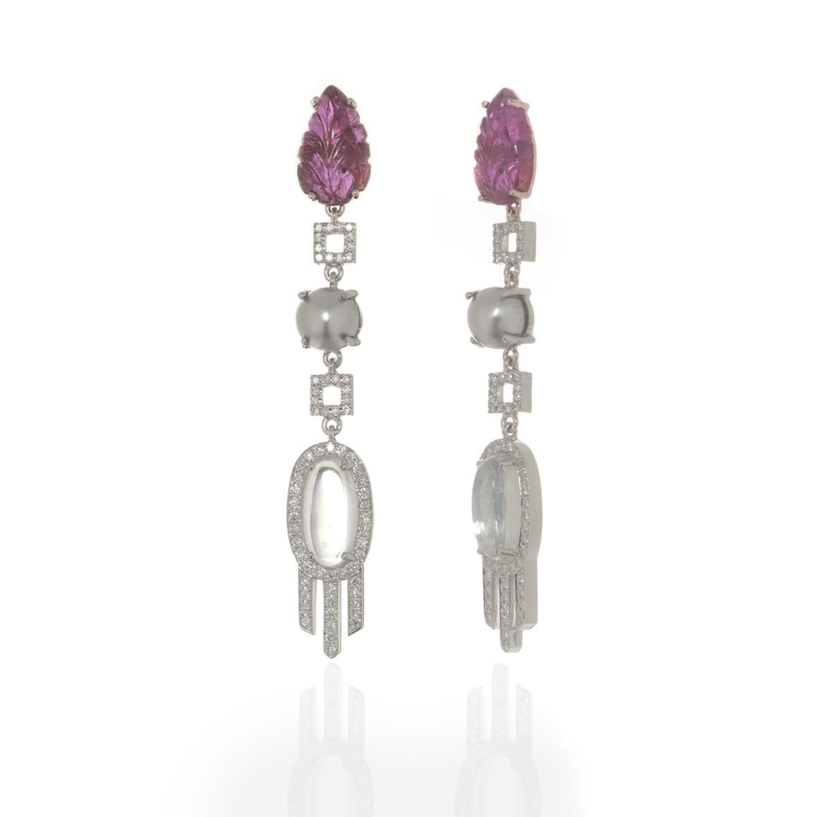 Carved Ruby, Moonstone and Diamond dangling earrings in 18 k white gold.

50.5 mm long