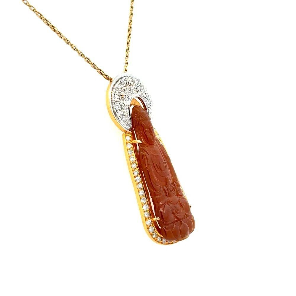 Simply Beautiful! Finely detailed Carved Rust Jade Buddha and Diamond Vintage Pendant Necklace. Featuring a Hand Carved Rust Jade Buddha. Surrounded by Diamonds, weighing approx. 0.50tcw. Pendant Hand crafted in  2-tone 14K and 18K Yellow and White