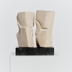 Carved sandstone abstract monolith sculptures on granite plinth - signed