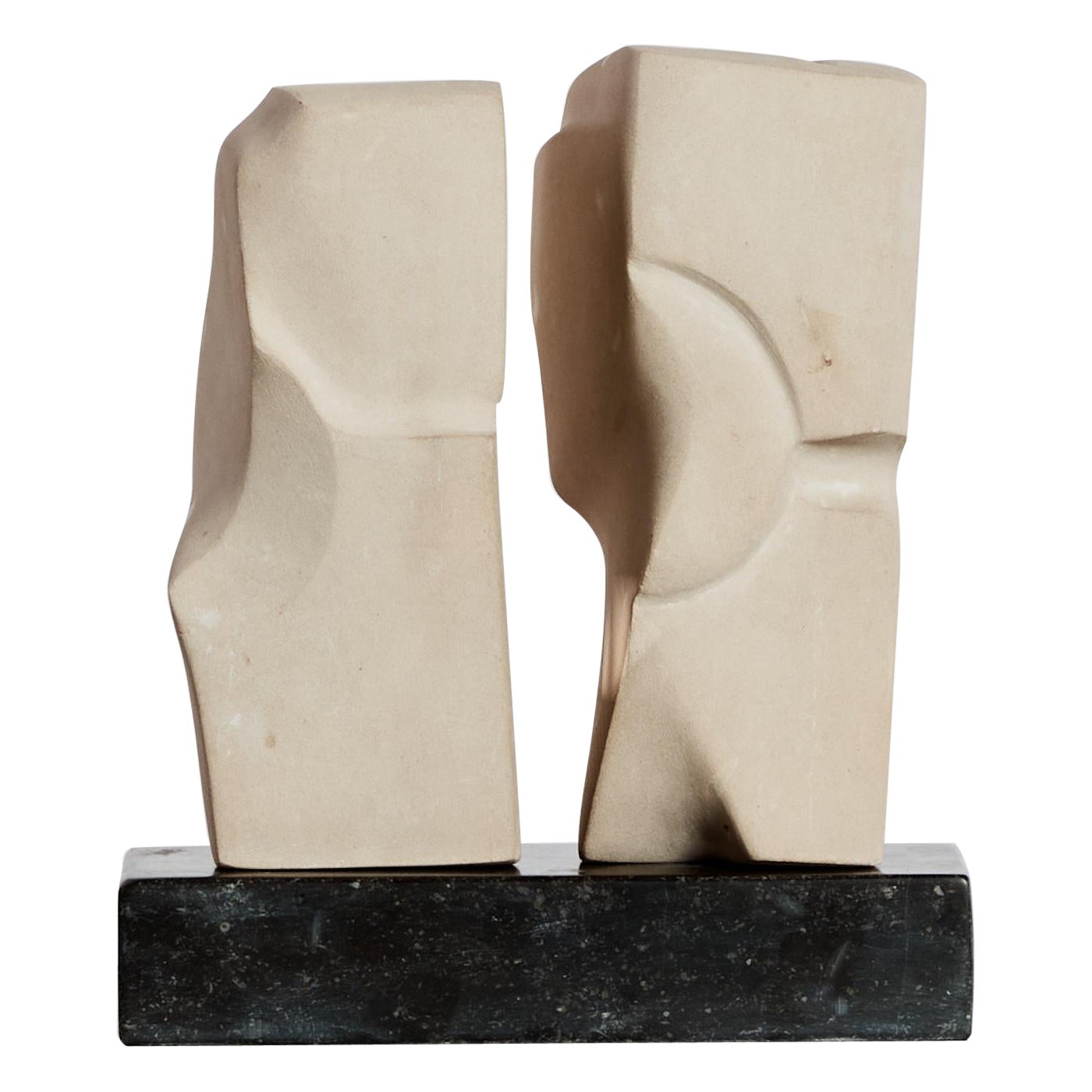 Carved sandstone abstract monolith sculptures on granite plinth - signed