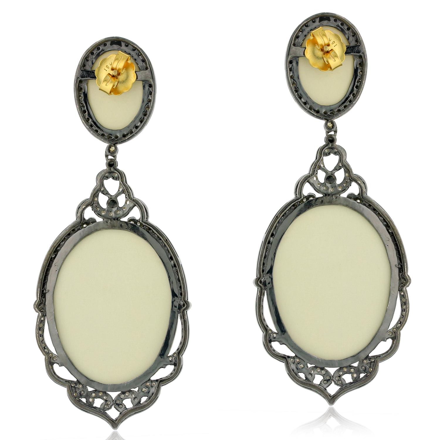 Elevate your style with these exquisite Carved Shell Cameo Earrings, surrounded by Pave Diamonds in 18k Gold & Silver. Perfect for adding a touch of timeless elegance to any outfit, these earrings feature intricate shell cameo carving in a classic