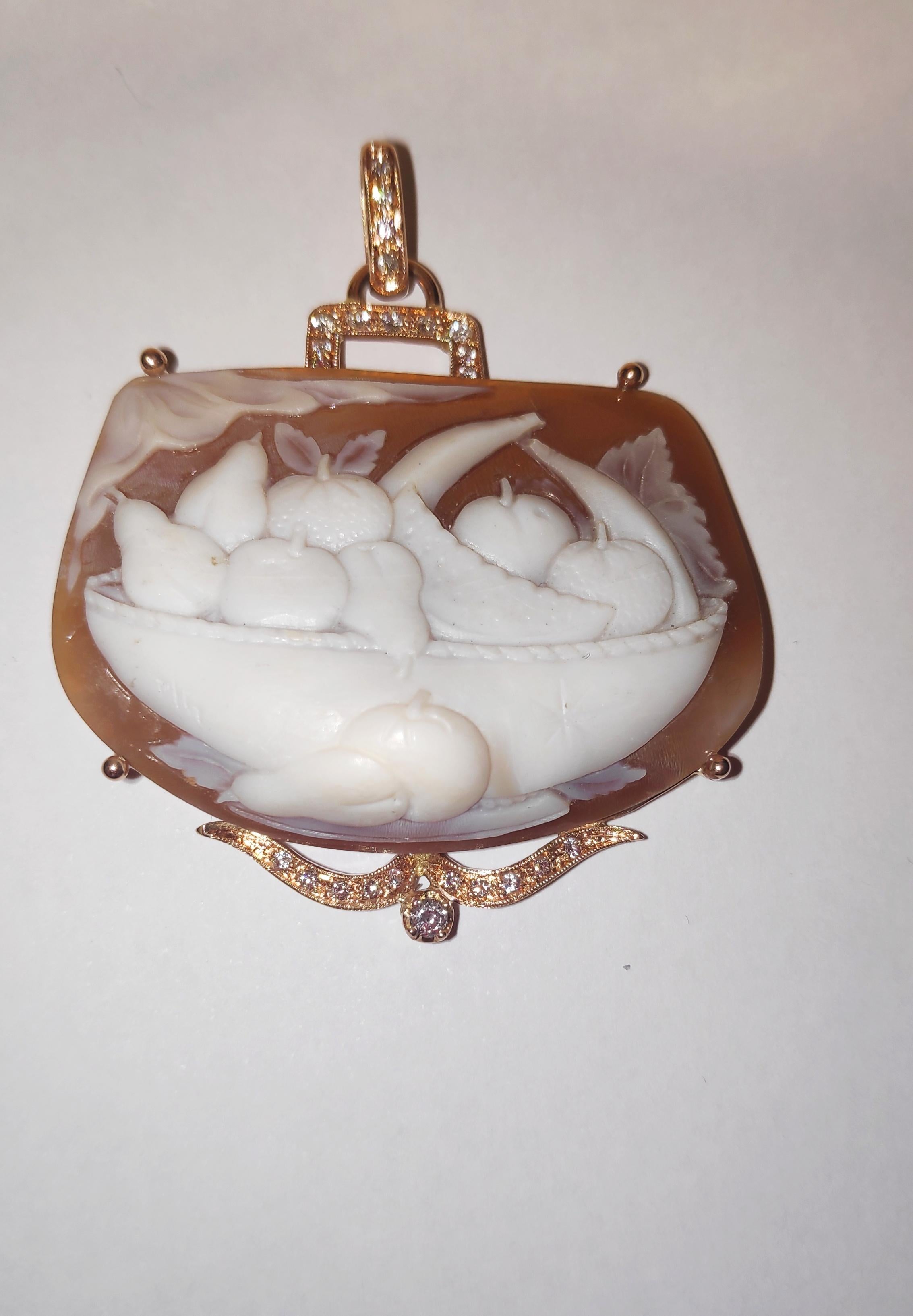 Carved shell Cameo with fruits Pendant 12kt pink gold with diamonds .
Offered here is a large shell cameo set in a fabulous 12K gold hand made frame with 0,50 ct diamonds.
This museum quality cameo depicts a basket with fruits in relief. It is
