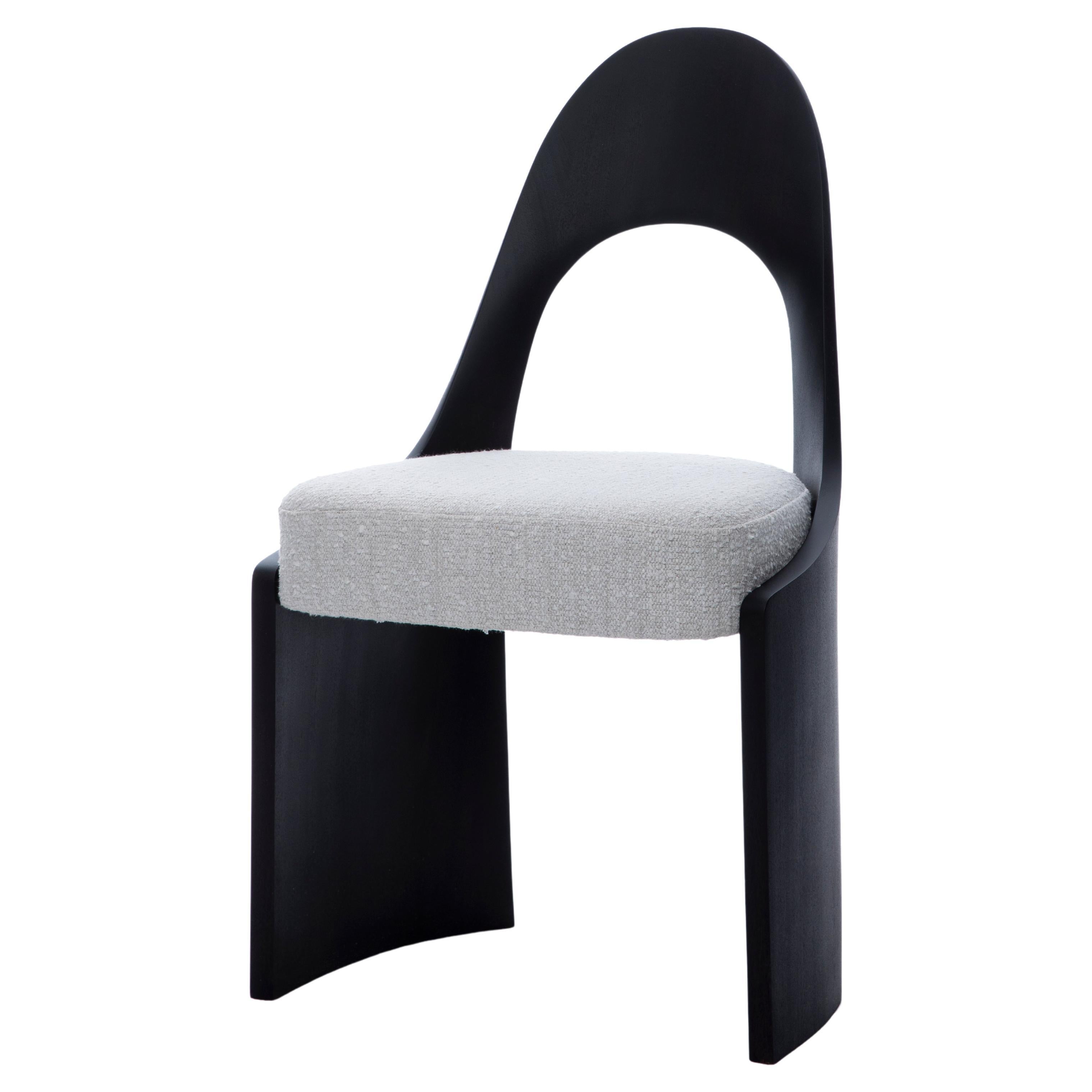 The Gaia chair is ideal as a dining side chair, but could be placed as a “slipper” almost anywhere for a stylish accent or convenient seating. Available in 3 custom finishes: Cerused, Ebonized or Wood tone. 
Upholstery additional cost-$300 per. 