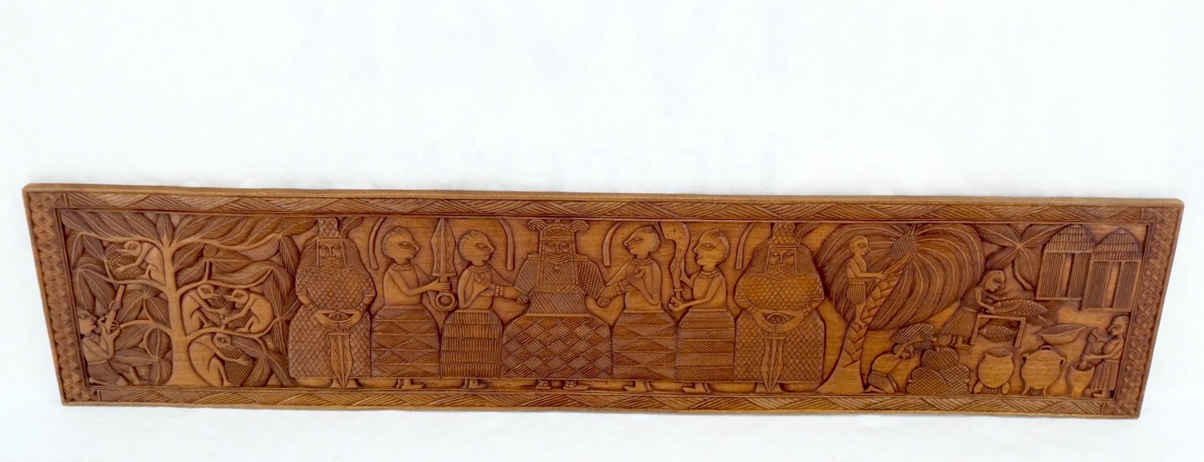 Large  Carved Solid Teak Long Rectangle Wall Plaque Relief Sculpture Depicting Jangle Villagers.