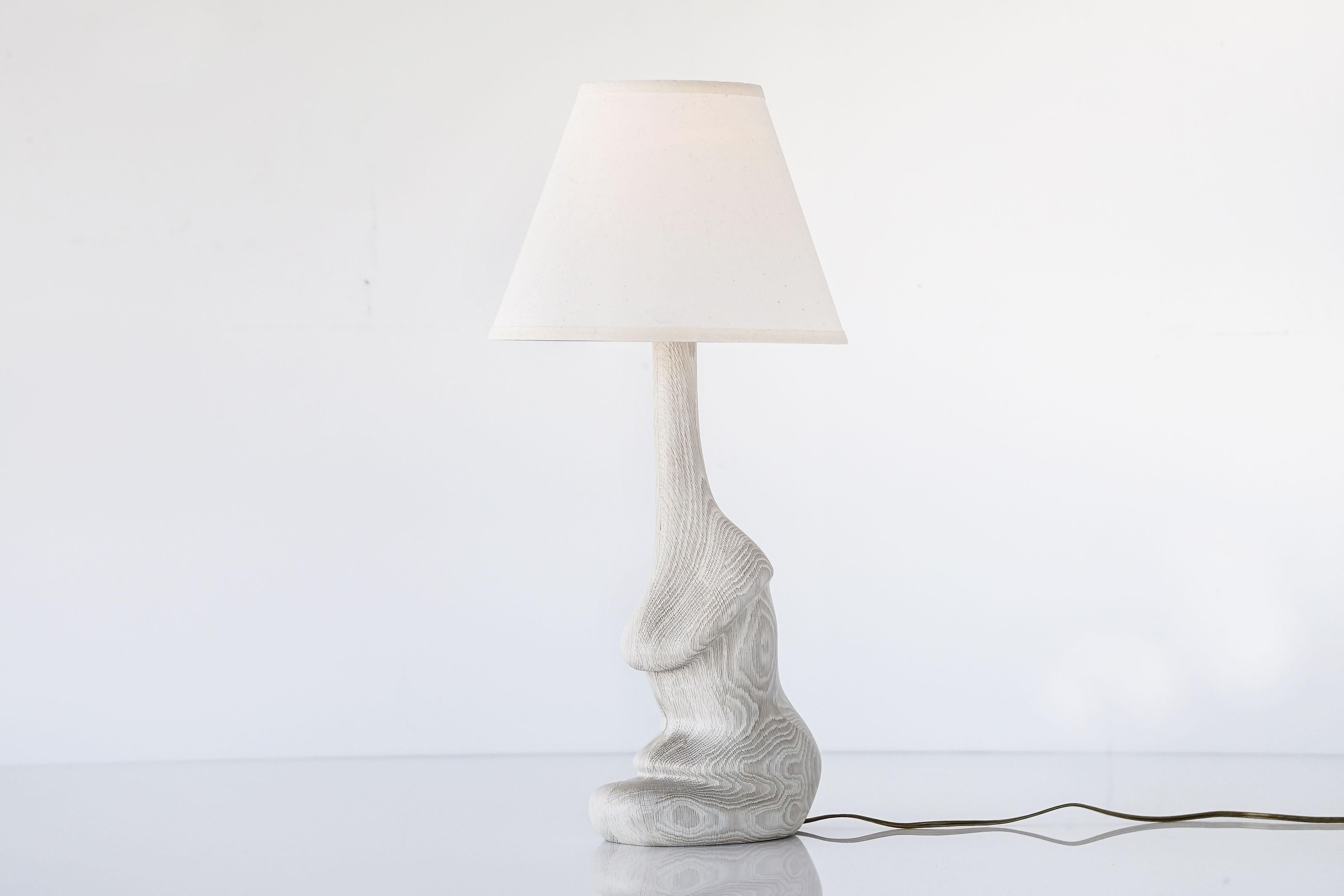 Carved solid white oakwood table lamp inspired by mushrooms. 

Shown in bleached white oak with wax finish with white linen lamp shade. 

Custom wood types available. 

Custom lamp shade available.