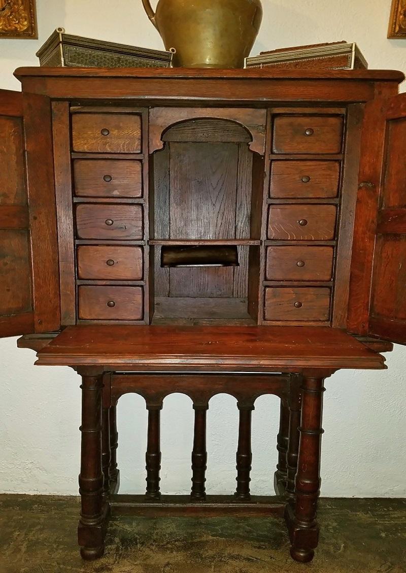 Presenting an absolutely stunning 16th century carved Spanish oak writing desk and cabinet, with amazing provenance and historical and literary significance. 
This desk/cabinet was purchased by a wealthy Dallas family from a French antique auction