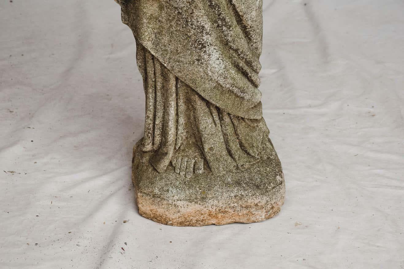 This is a carved stone statue of The Sacred Heart of Jesus. We believe this statue was once used outside of a church. This beautiful statue could be used in your home or garden.
This piece weighs 83 lbs.